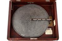 A Criterion 15 3/4 Inch Disc Music Box with 12 Discs