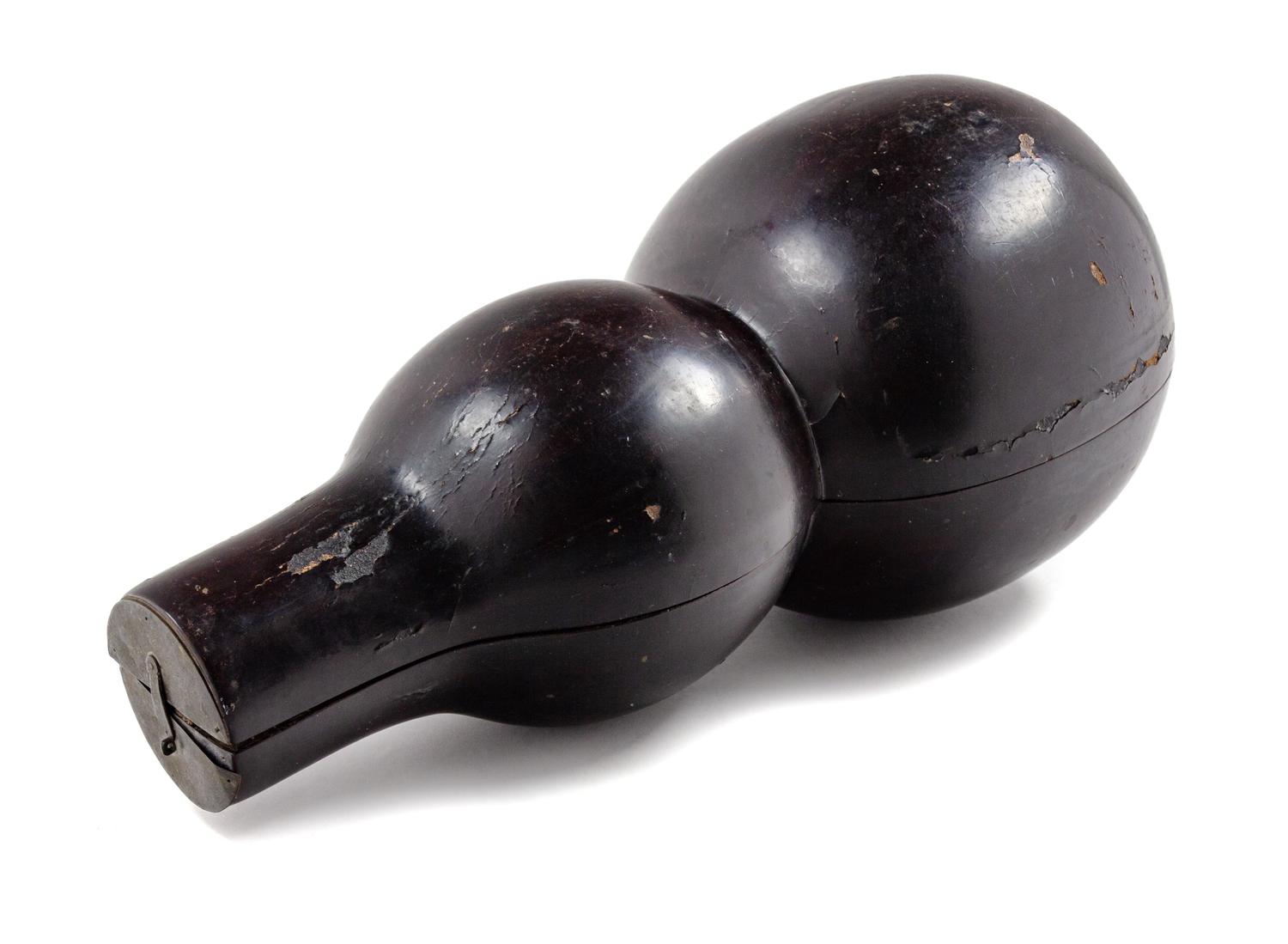 A Chinese Black Lacquered Wood Gourd-Form Box Length 19 inches.