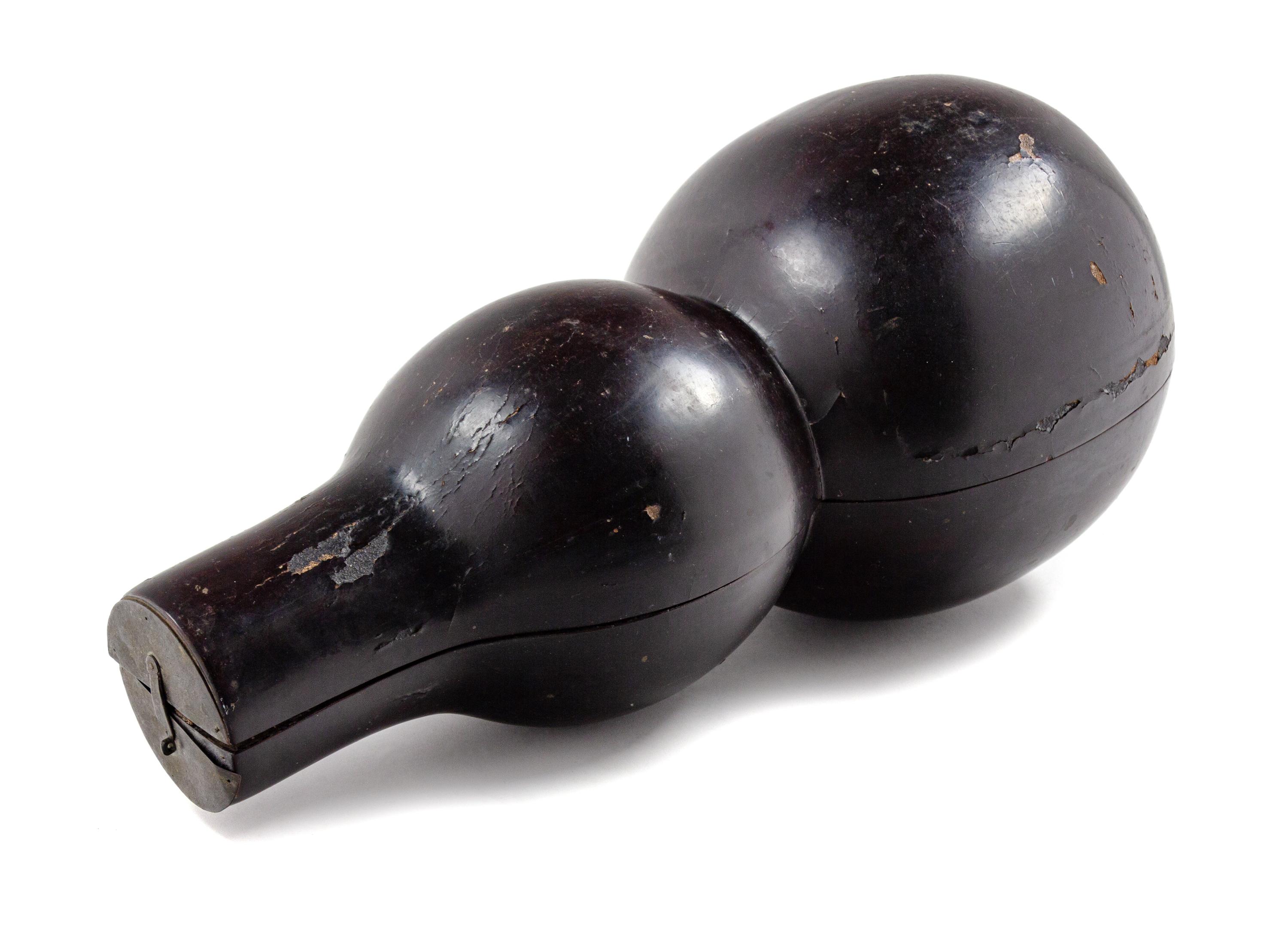 A Chinese Black Lacquered Wood Gourd-Form Box Length 19 inches.