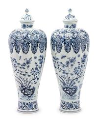 A Pair of Delft Covered Vases