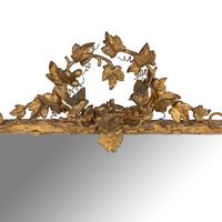 A Continental Carved Giltwood and Gesso Mirror