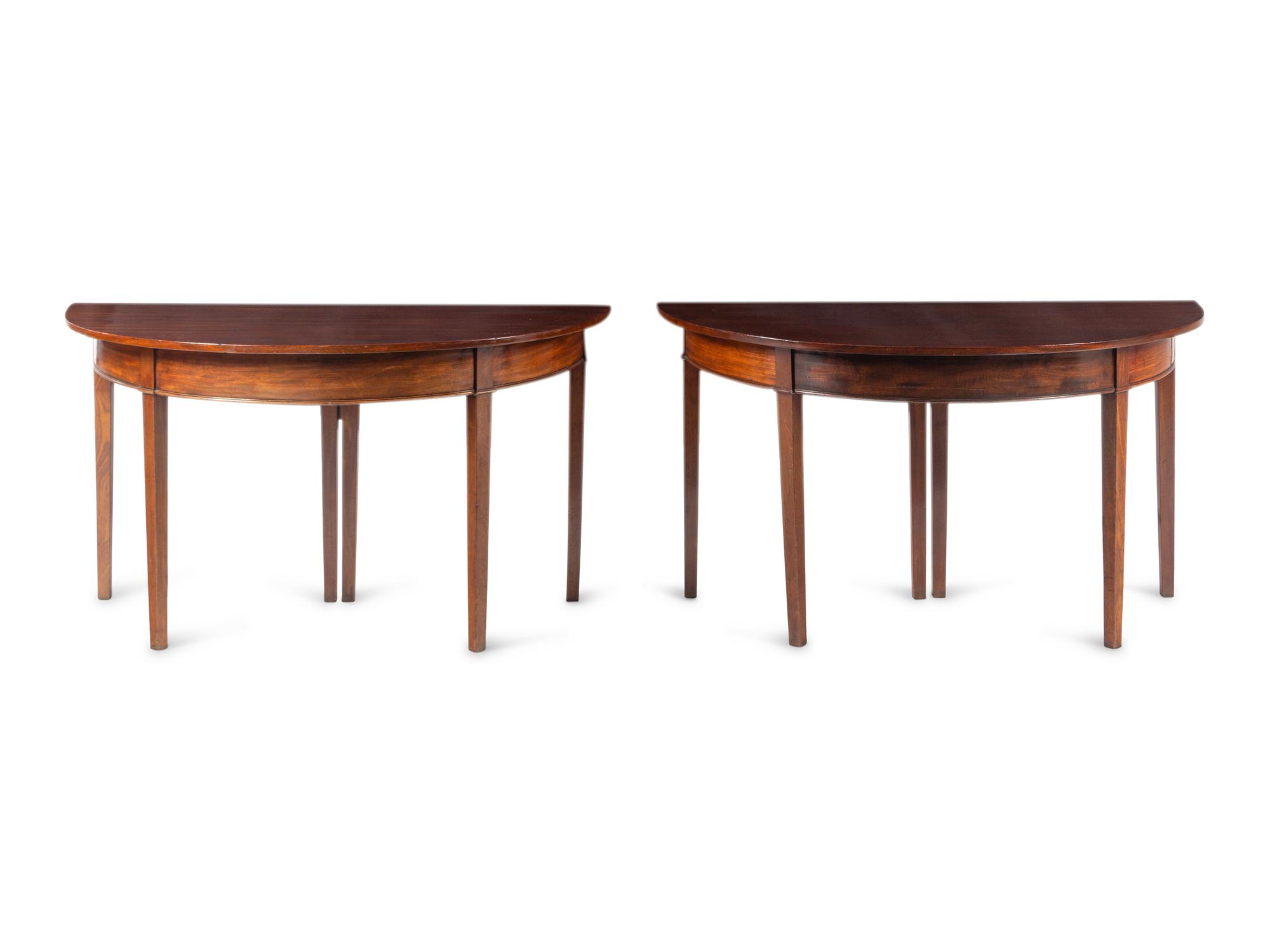 A Pair of George III Mahogany Demilune Console Tables Converting to a Dining Table