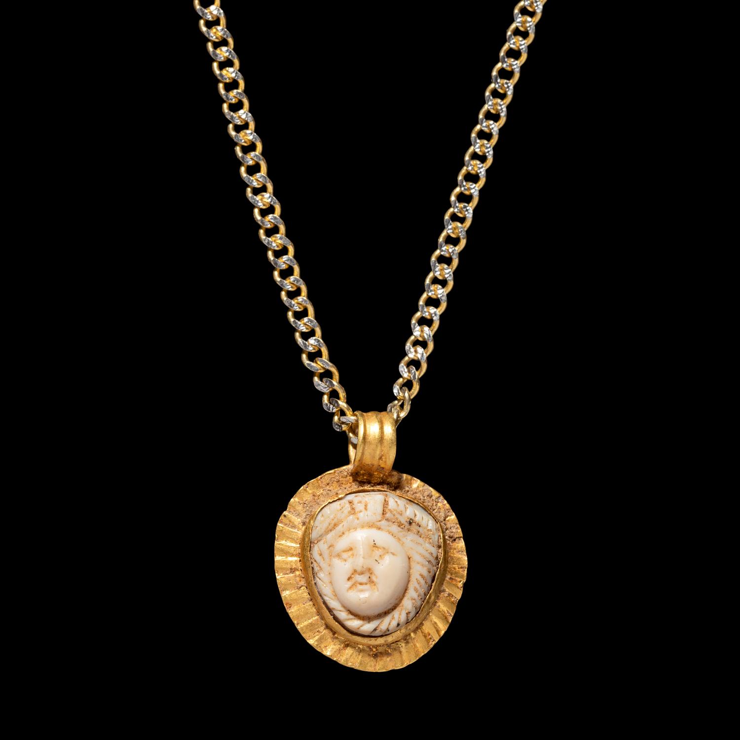 A Roman Gold and Onyx Cameo Pendant with Medusa — with a modern gold chain