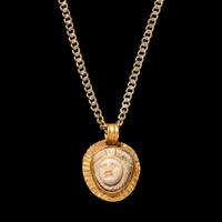 A Roman Gold and Onyx Cameo Pendant with Medusa — with a modern gold chain