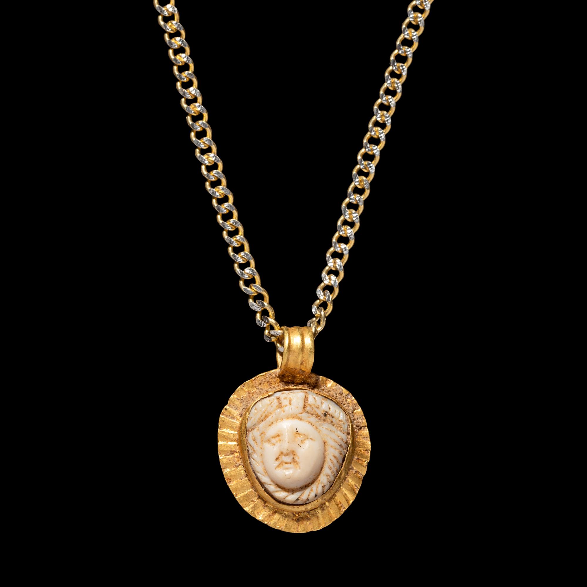 A Roman Gold and Onyx Cameo Pendant with Medusa — with a modern gold chain