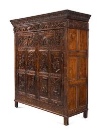 A Continental Carved Oak Wardrobe Cabinet