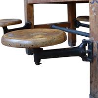 An Industrial Table with Swing Arm Seats 71" W x 29.5" D x 30" H — United States, Circa 1930