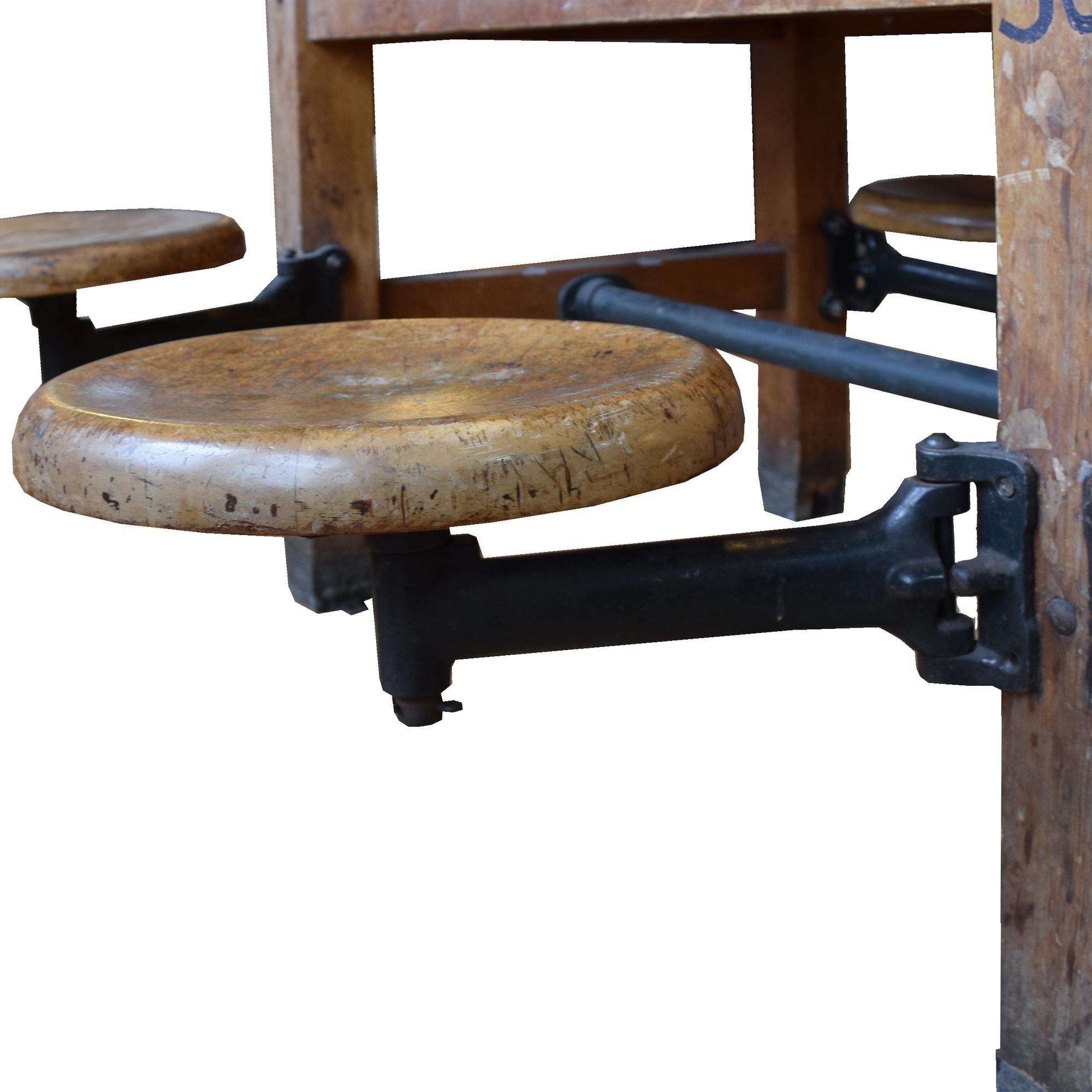 An Industrial Table with Swing Arm Seats 71" W x 29.5" D x 30" H — United States, Circa 1930