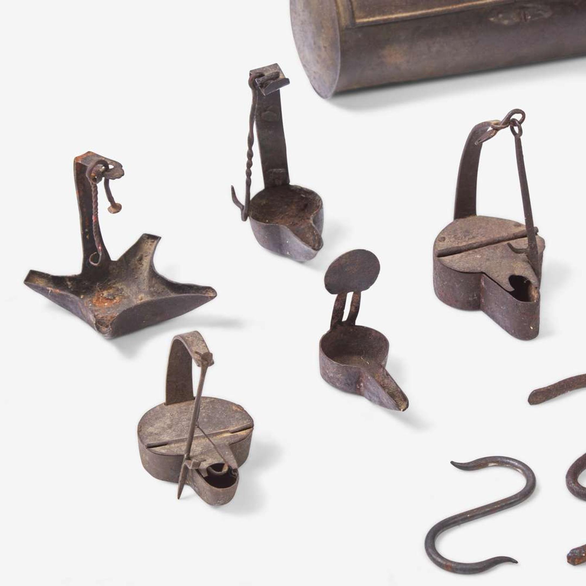 A group of ten wrought iron and tinware lighting devices 18th / 19th century