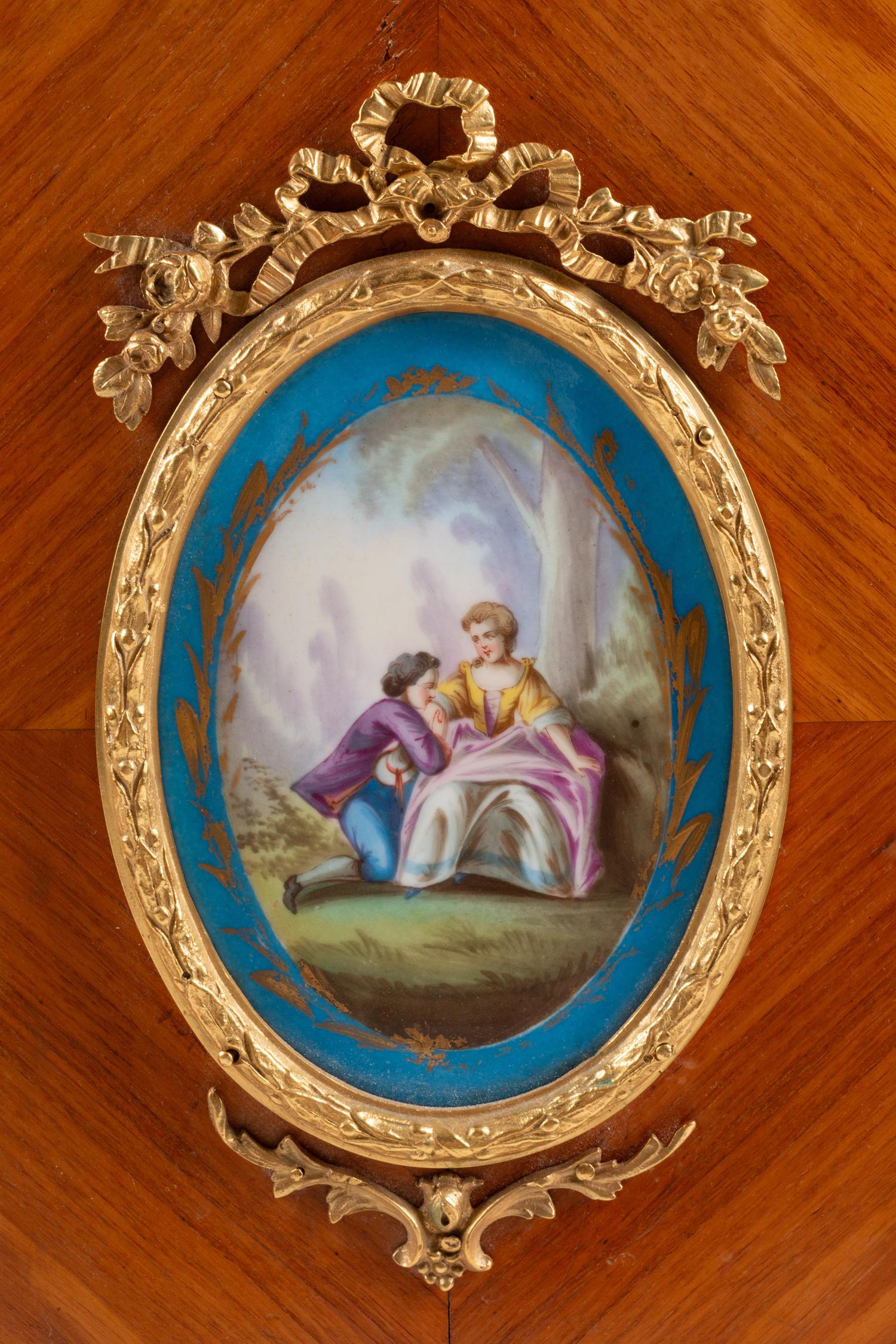 A French Gilt Bronze and Porcelain Plaque-Mounted Kingwood and Tulipwood Marble-Top Cabinet