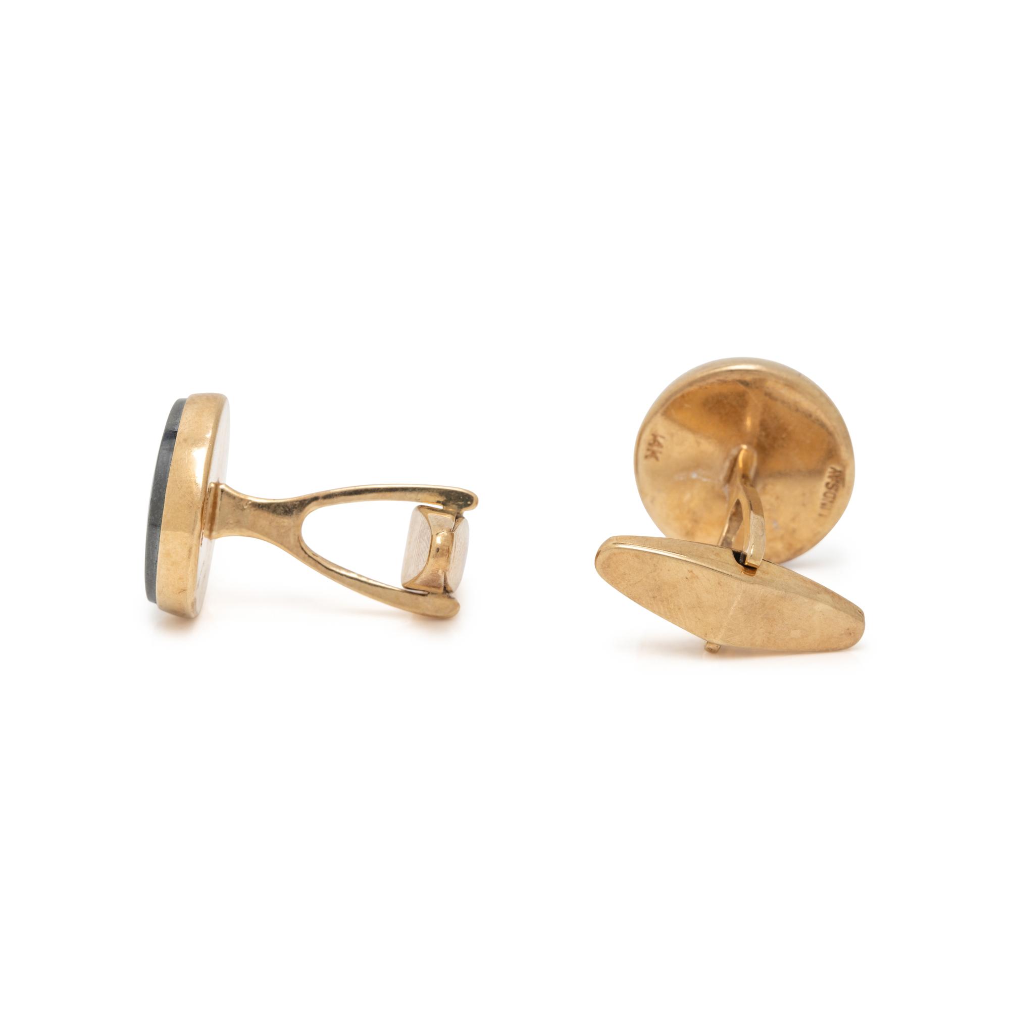 YELLOW GOLD, HEMATITE, AND RUBY CUFFLINKS