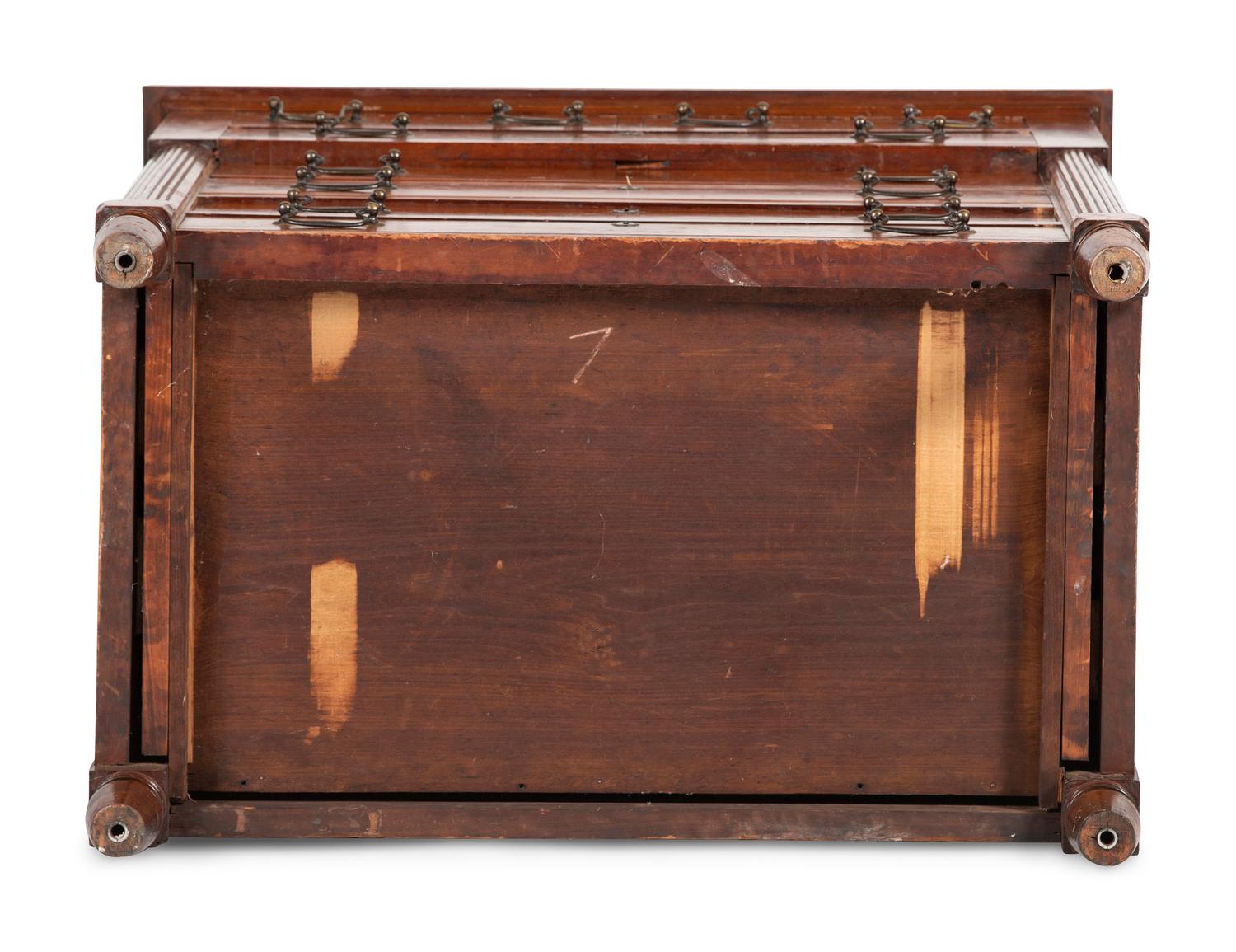 A Federal Carved and Inlaid Cherrywood Chest of Drawers