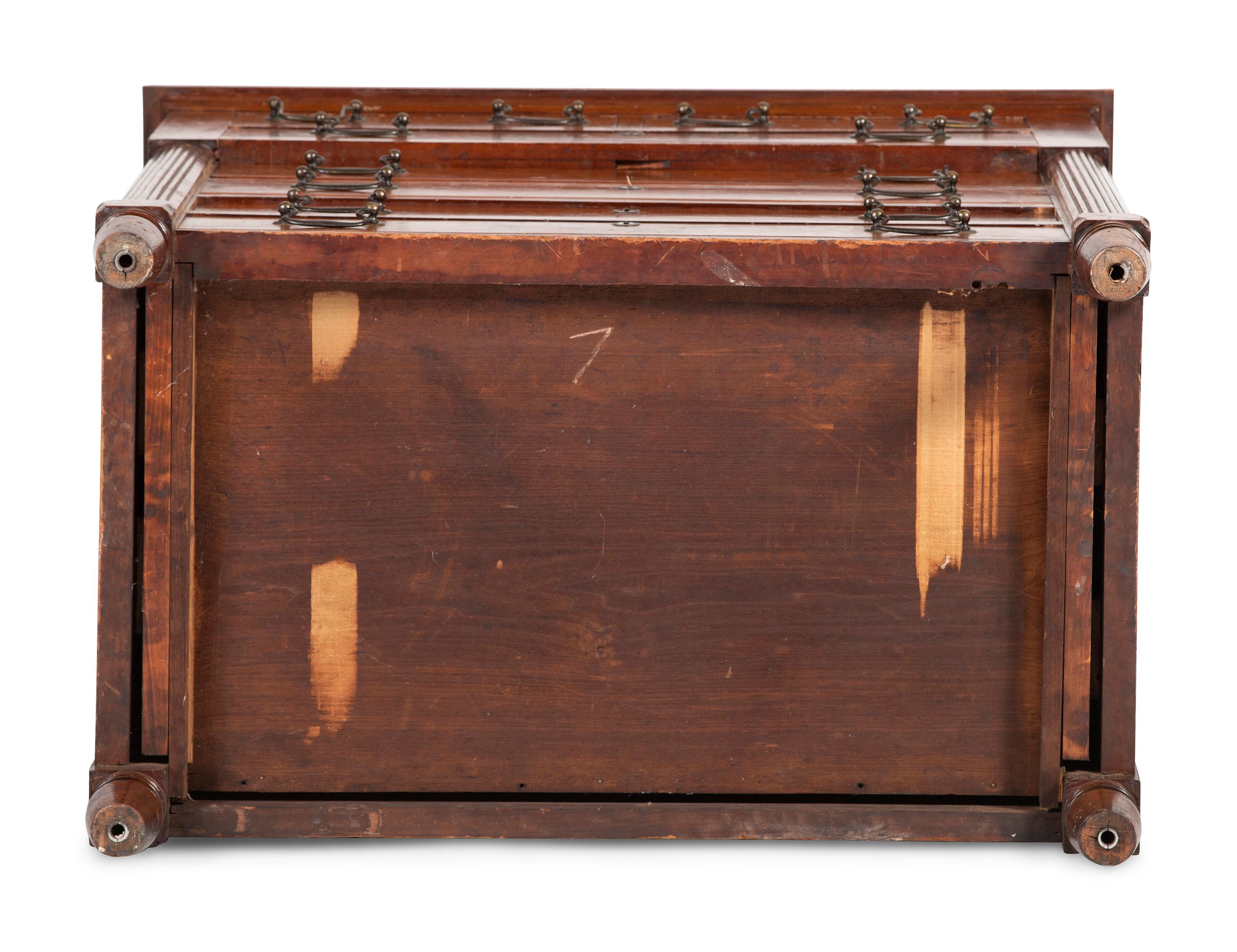A Federal Carved and Inlaid Cherrywood Chest of Drawers