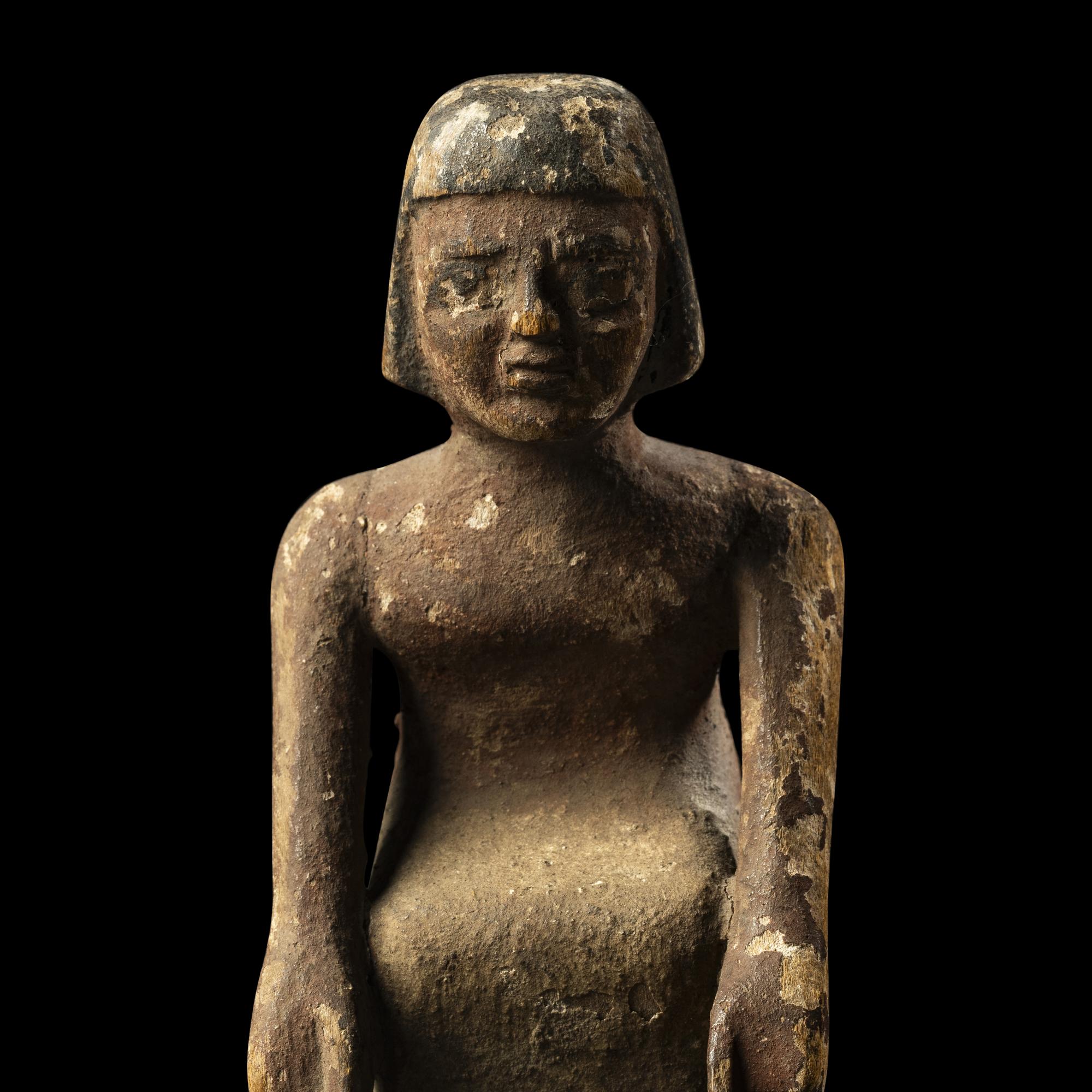 An Egyptian Painted Wood Boatman