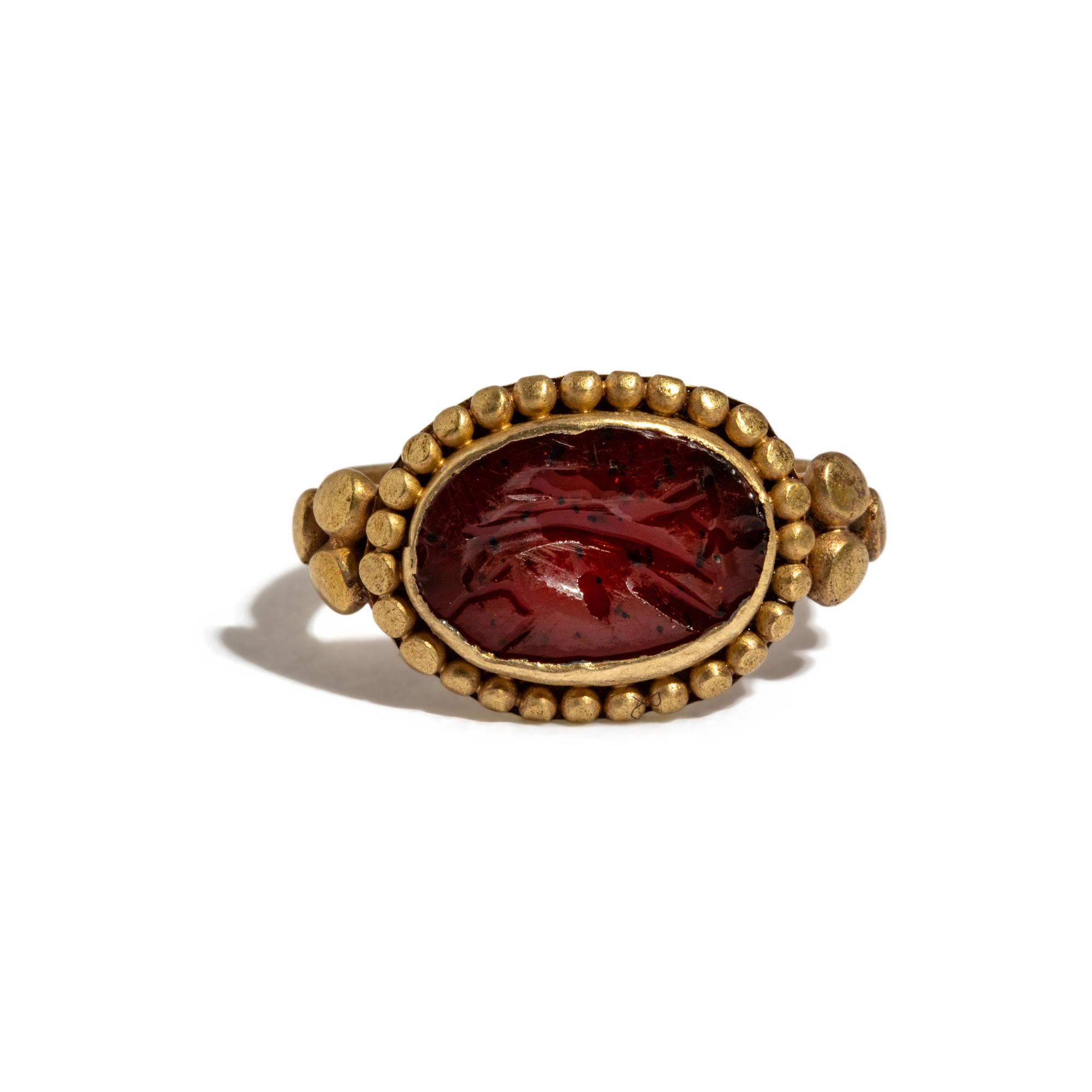 A Roman Gold and Carnelian Finger Ring with an Eagle