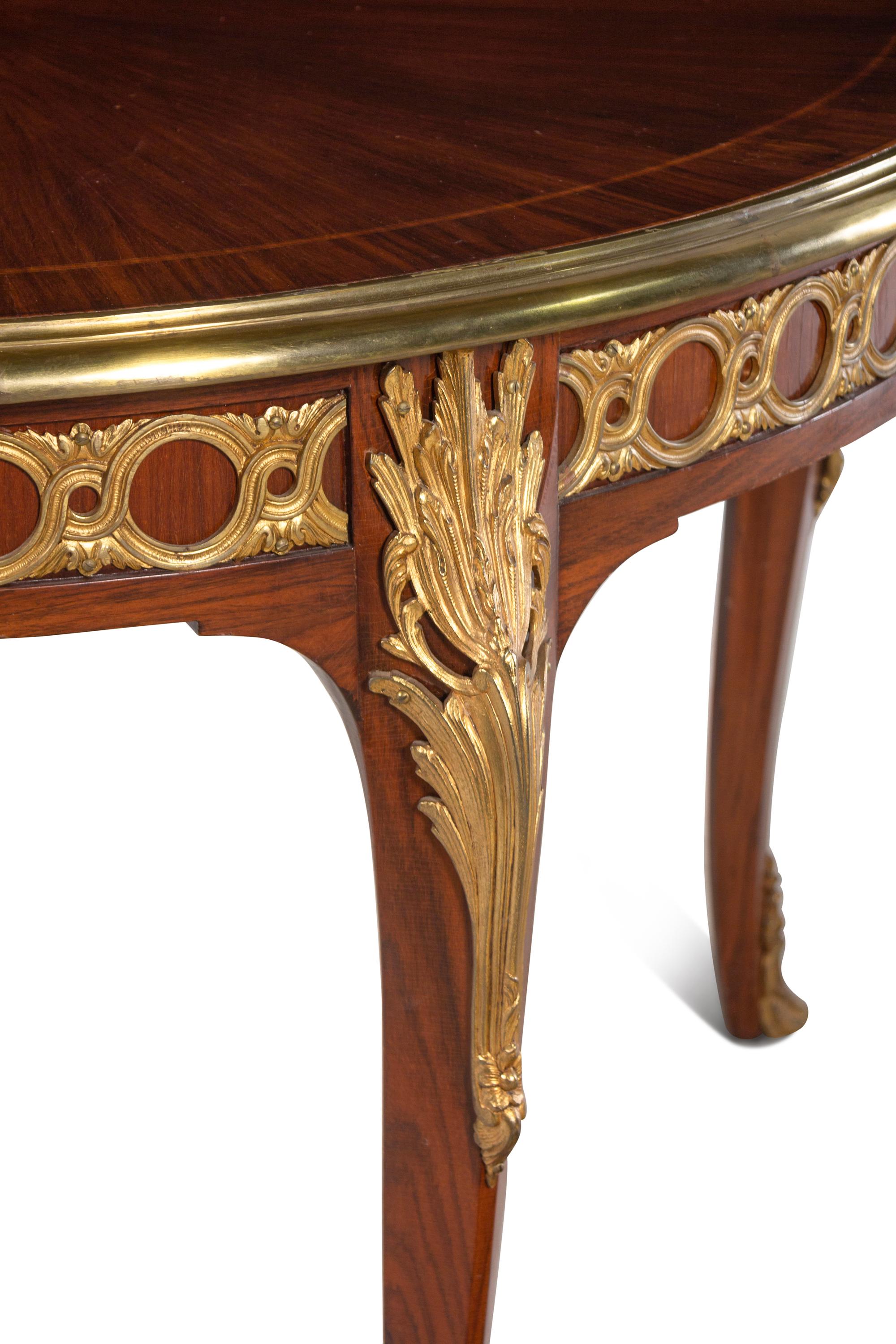 A Louis XVI Style Gilt Bronze Mounted Parquetry Dining Table