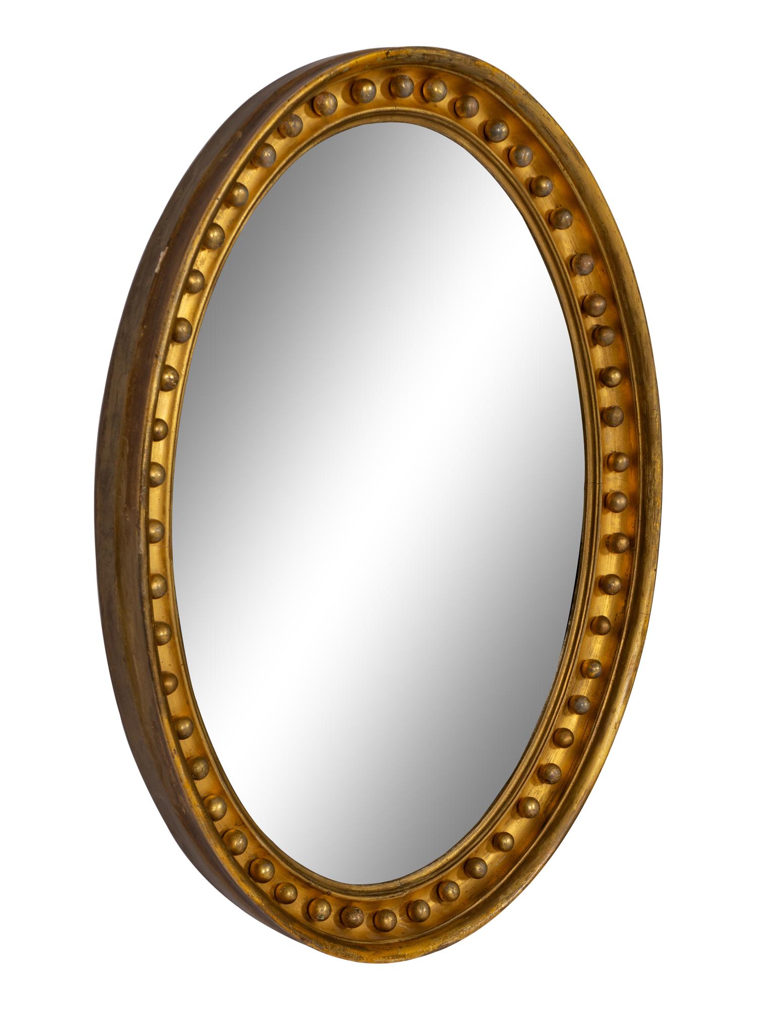 A Regency Style Oval Giltwood Mirror