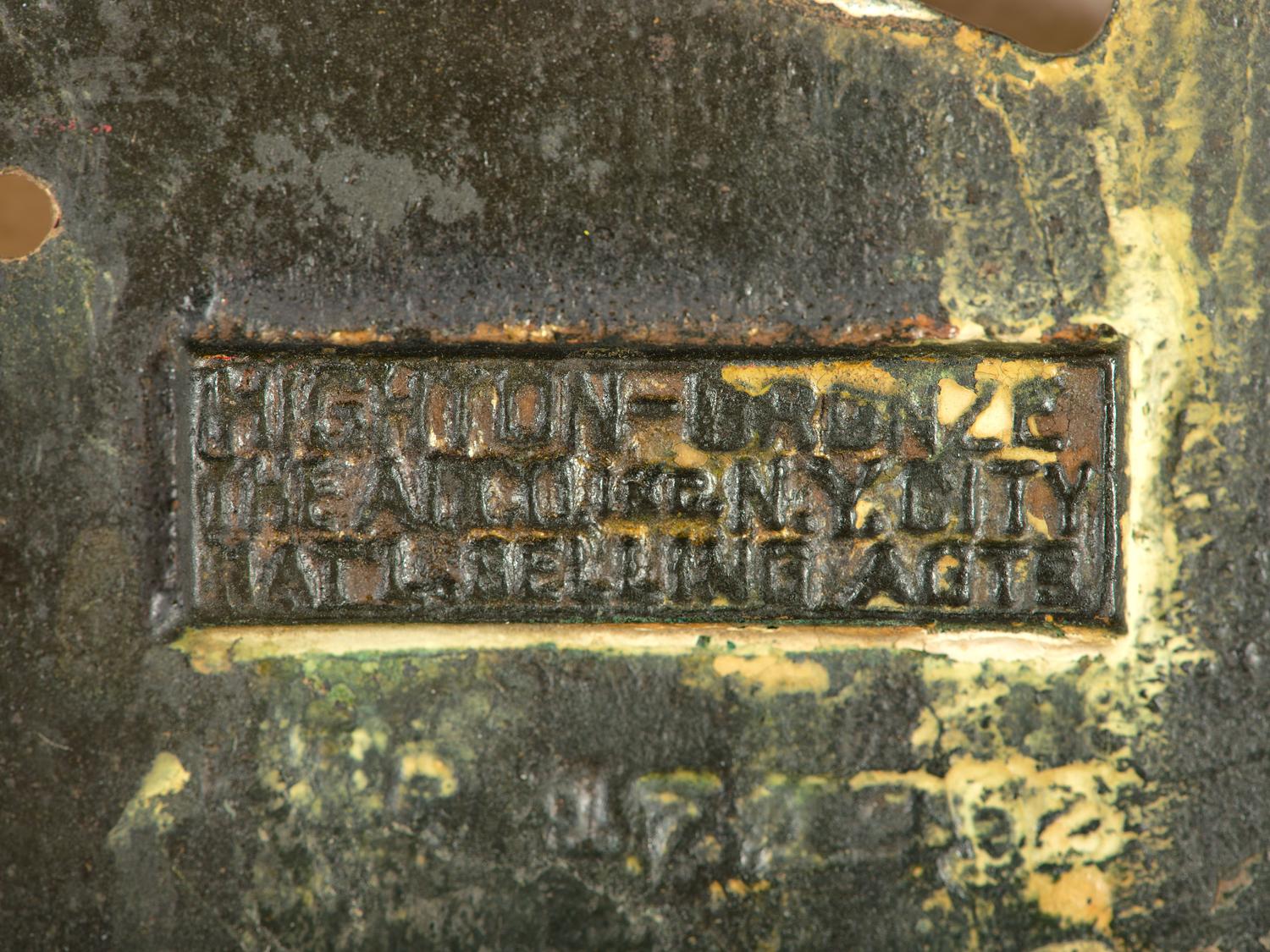 A Gold Painted Bronze Safety Pin Shop Sign