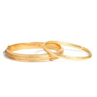 TWO YELLOW GOLD BANGLE BRACELETS