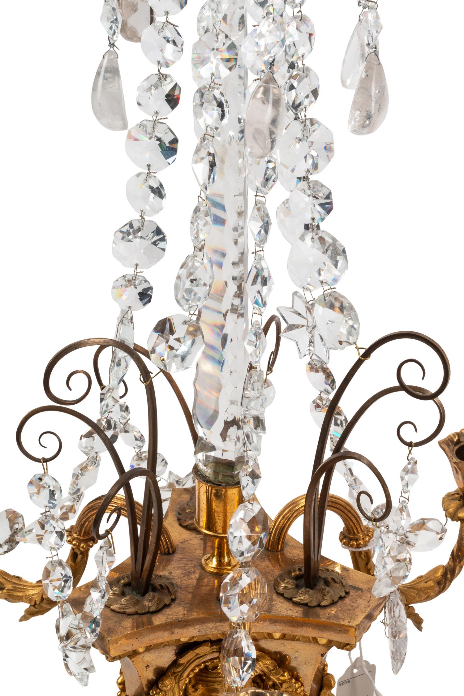 A Pair of French Gilt Bronze, Cut Glass and Rock Crystal Three-Light Candelabra