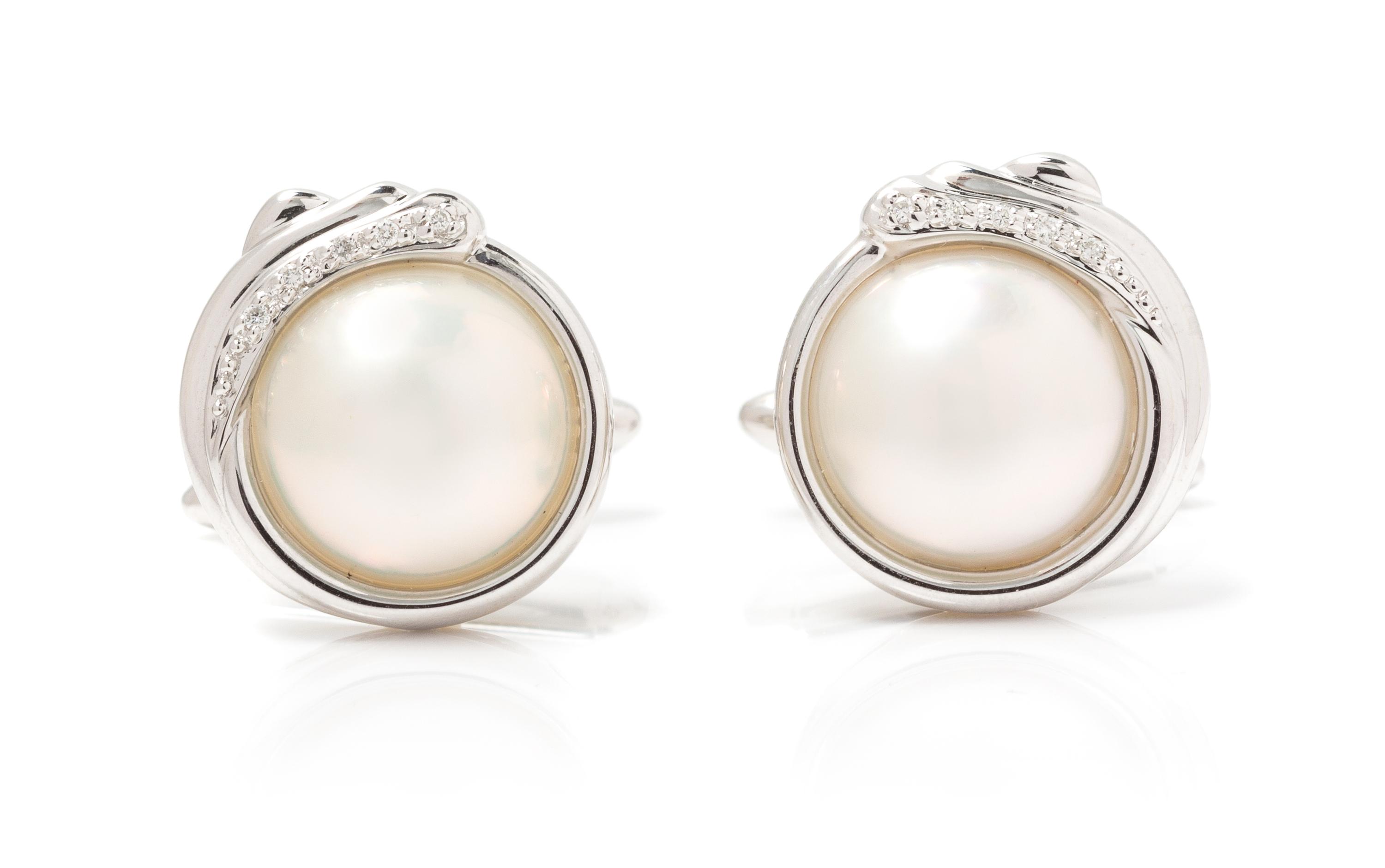 A Pair of 14 Karat White Gold, Mabe Pearl, and Diamond Cufflinks, 8.50 dwts.
