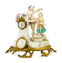 A Meissen Porcelain Figural Mantel Clock