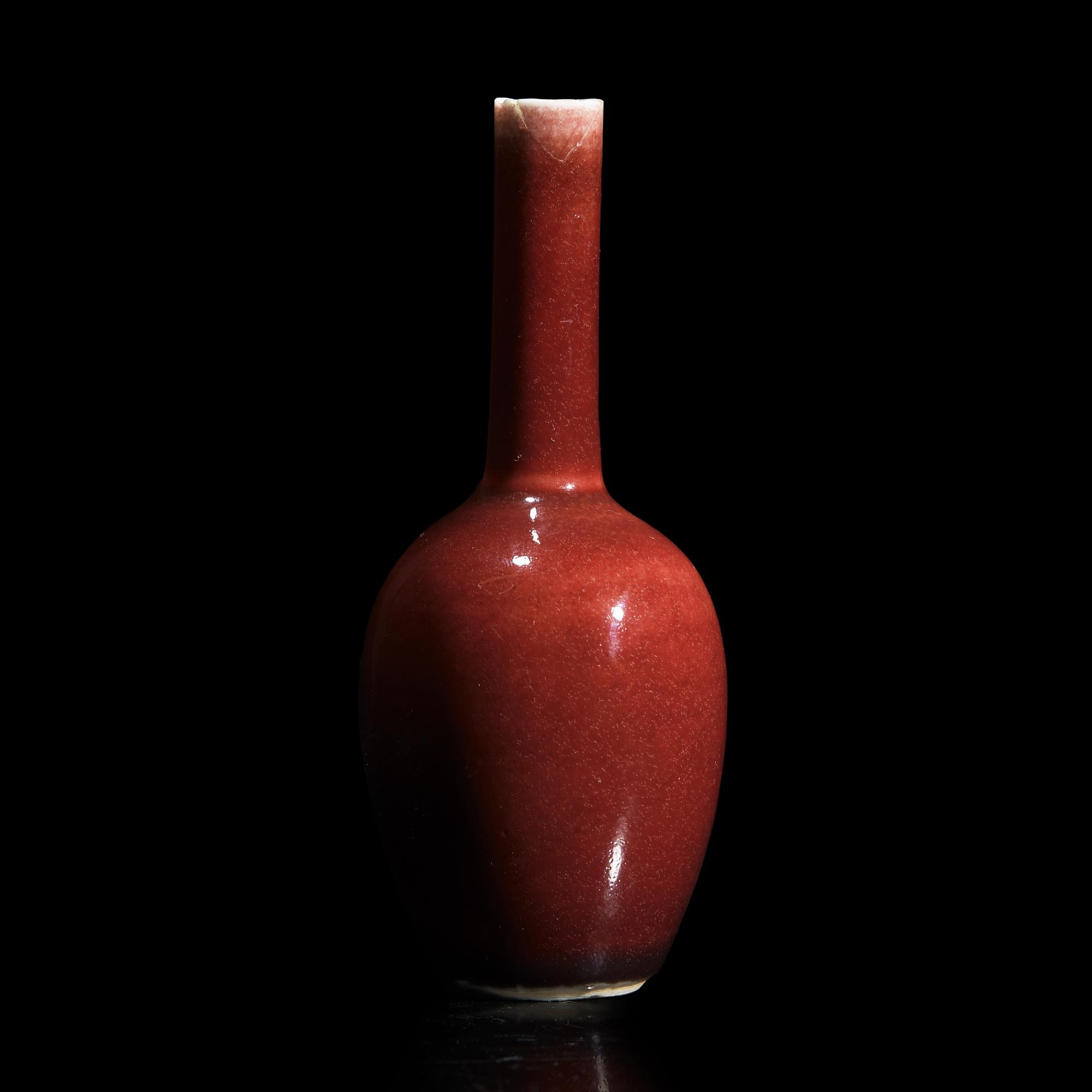 A Small Chinese Copper Red Glazed Cabinet Vase, 18th/Early 19th Century 清中期 祭紅釉小長頸瓶