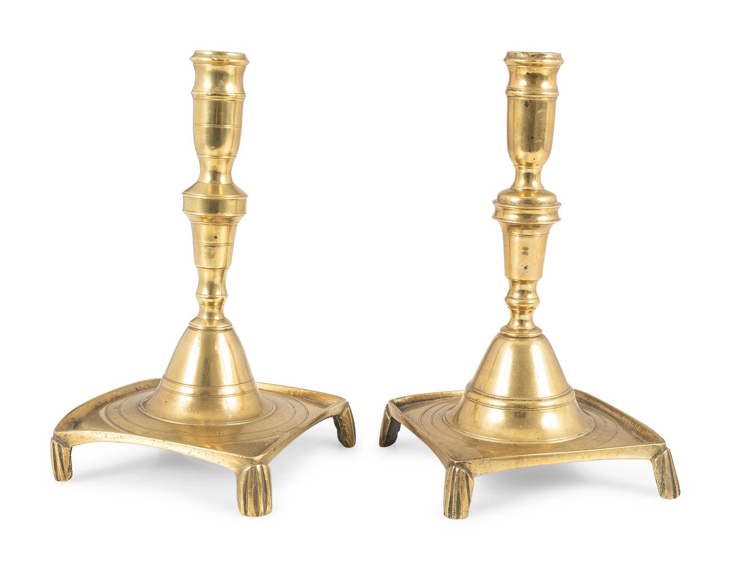 A Matched Pair of Continental Brass Footed and Dished Square Base Candlesticks