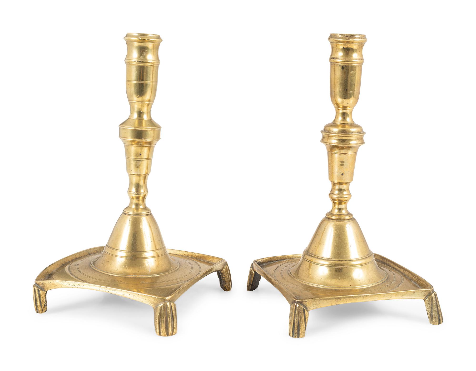 A Matched Pair of Continental Brass Footed and Dished Square Base Candlesticks