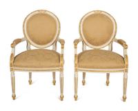A Set of Eight Louis XVI Style Painted and Parcel Gilt Fauteuils