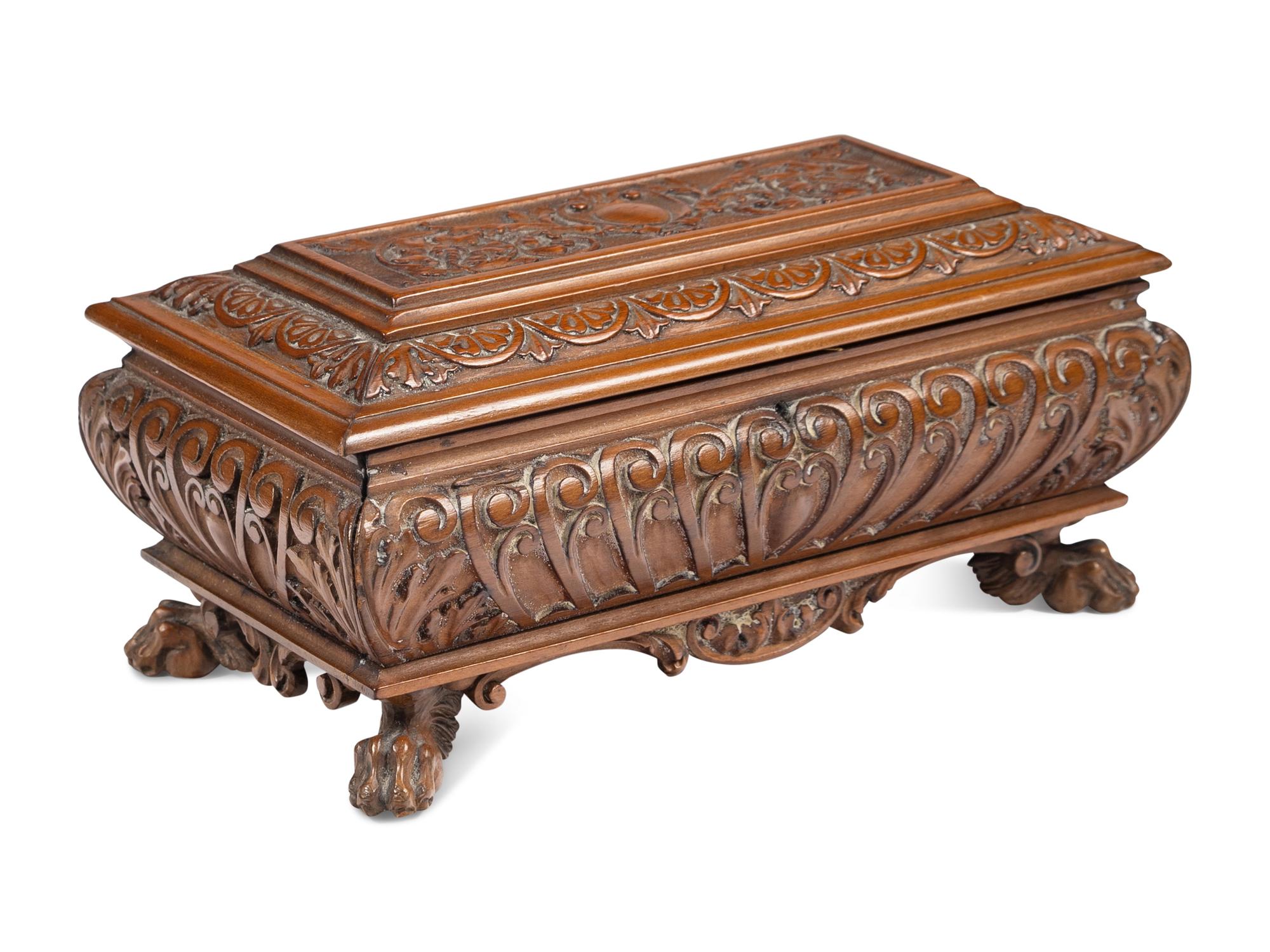 An Italian Carved Walnut Miniature Cassone or Table Casket