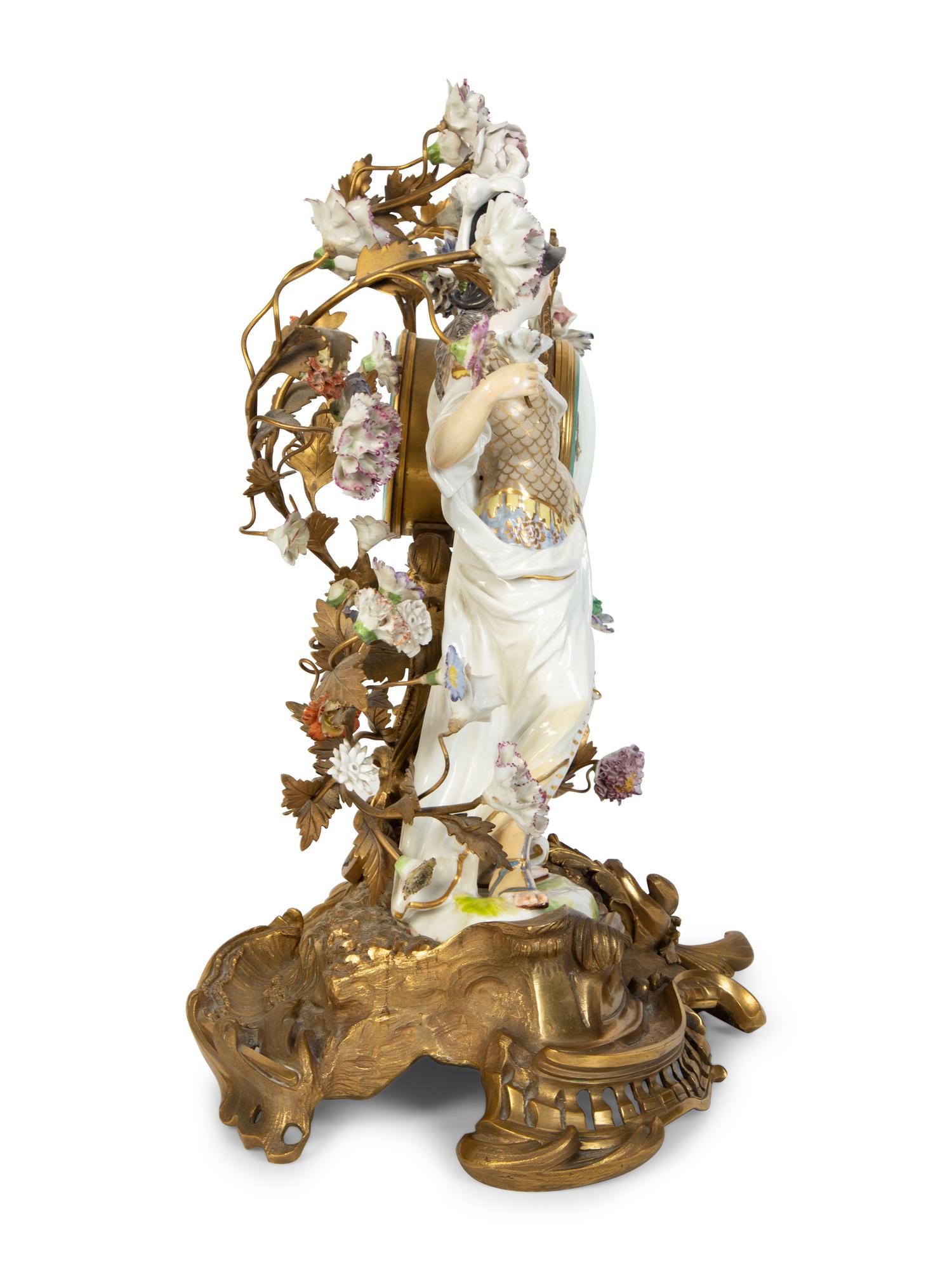 A Continental Gilt Bronze and Porcelain Figural Mantel Clock