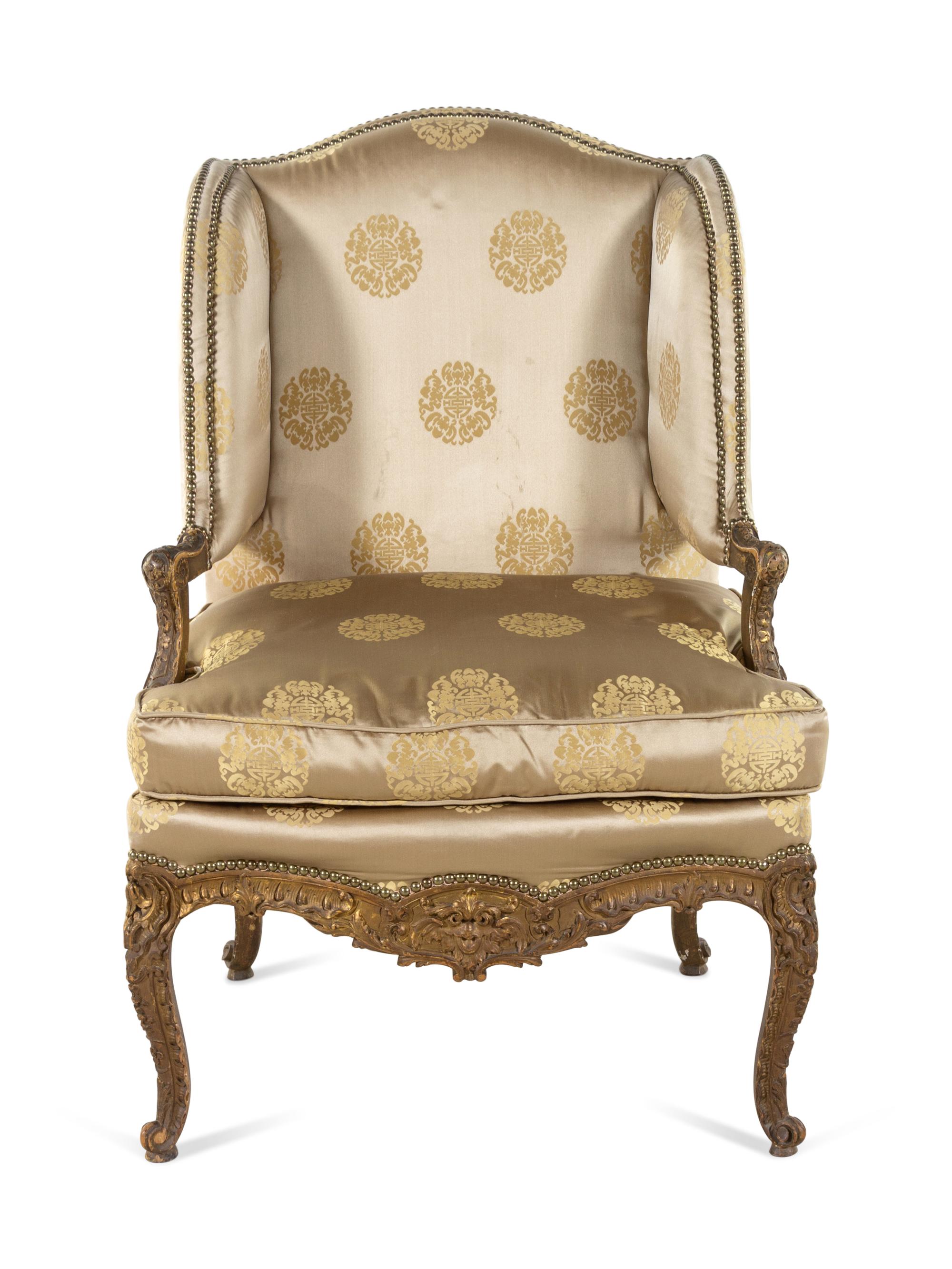 A Louis XV Style Carved and Giltwood Fauteuil à Oreilles