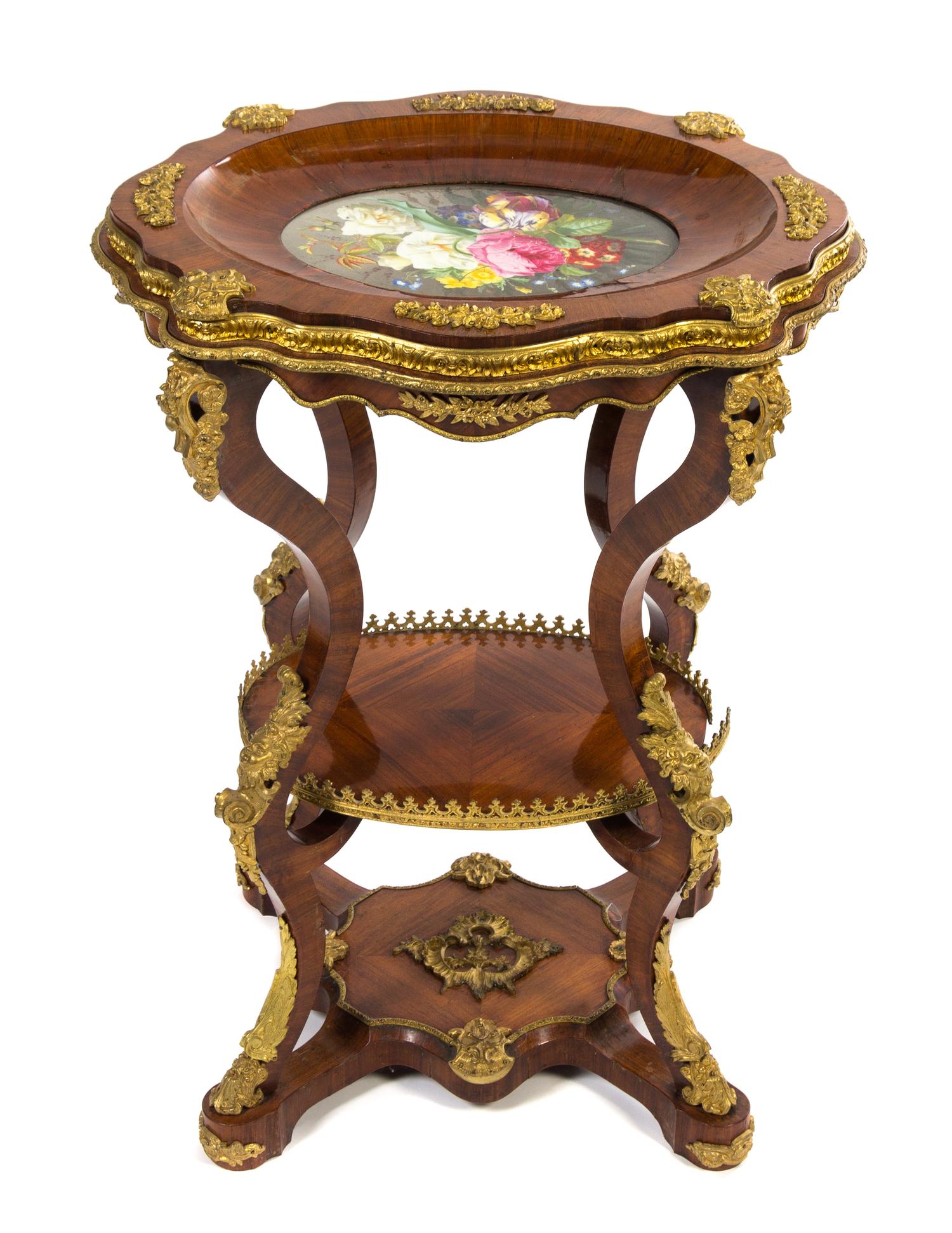 A Napoleon III Gilt Bronze and Porcelain Mounted Fruitwood Table Height 30 x width 22 1/2 x depth 19 inches. — MID-19TH CENTURY