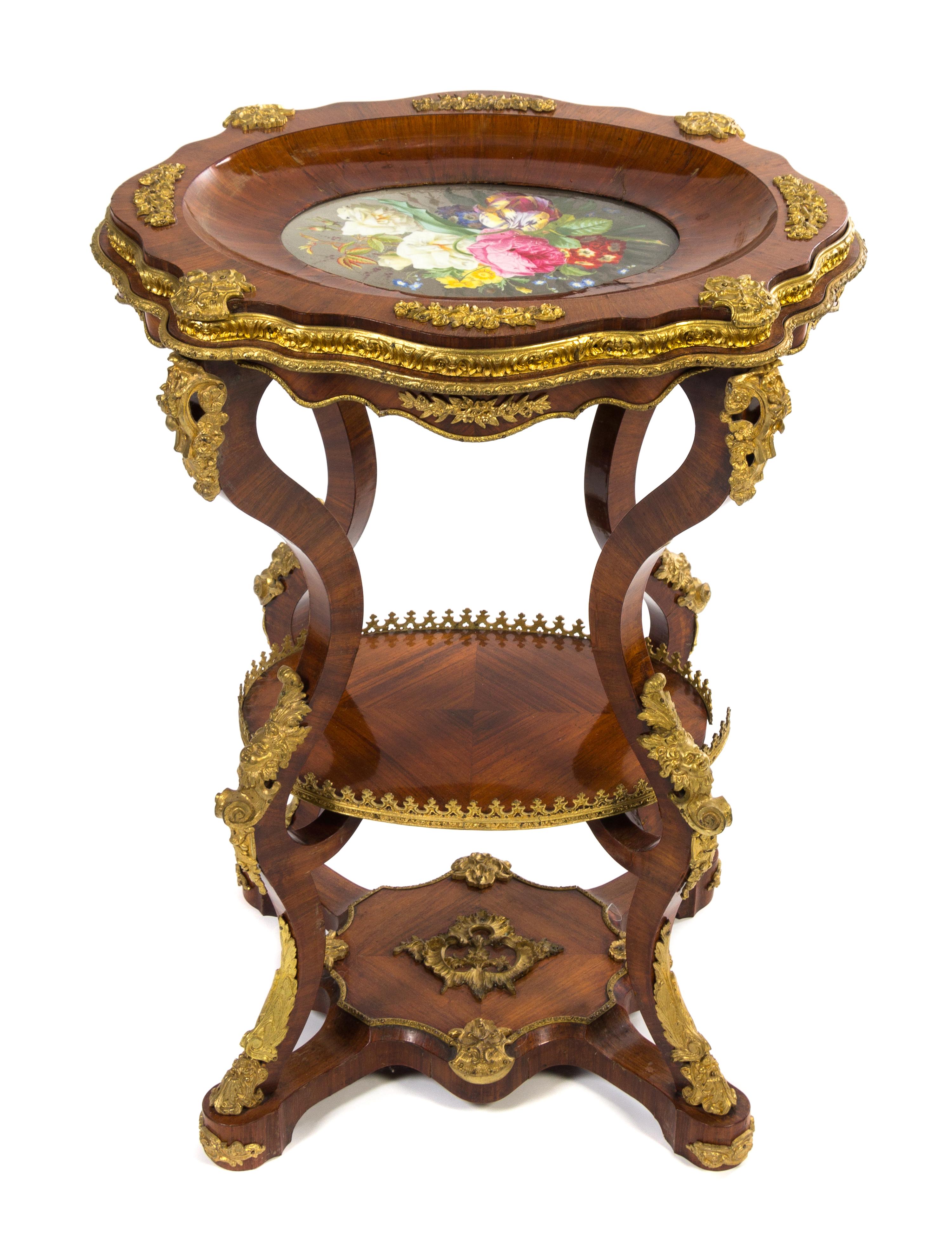 A Napoleon III Gilt Bronze and Porcelain Mounted Fruitwood Table Height 30 x width 22 1/2 x depth 19 inches. — MID-19TH CENTURY