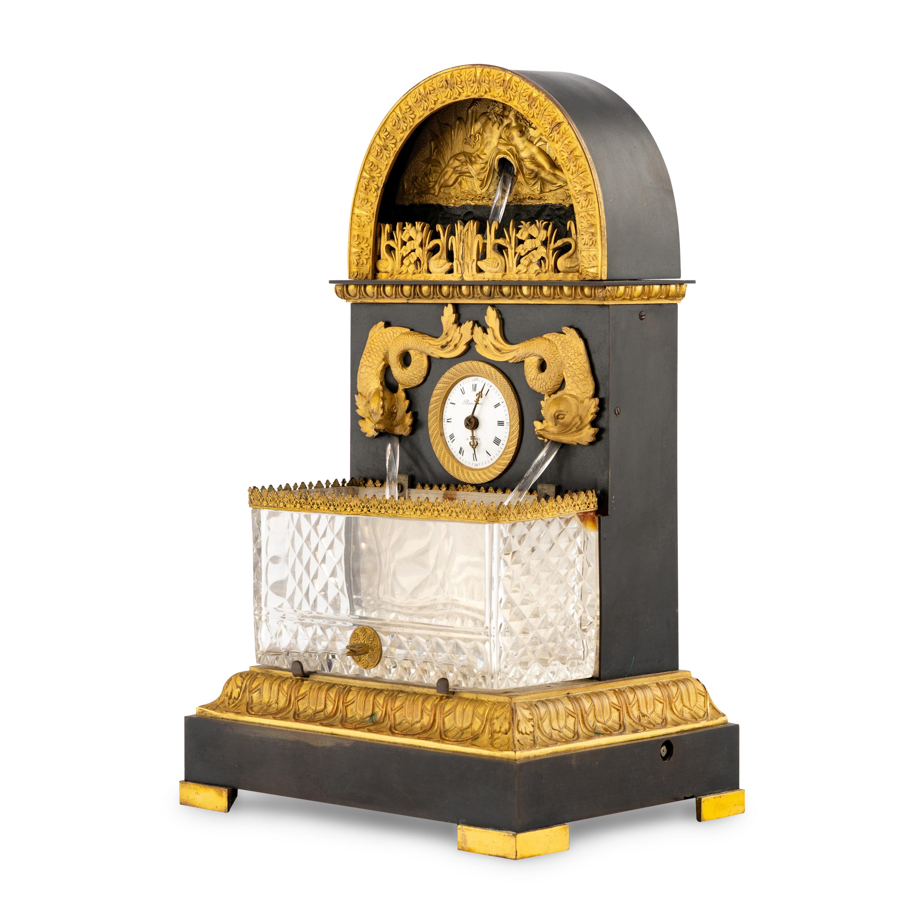 A French Patinated and Gilt Bronze and Cut Glass "Fountain" Mantel Clock