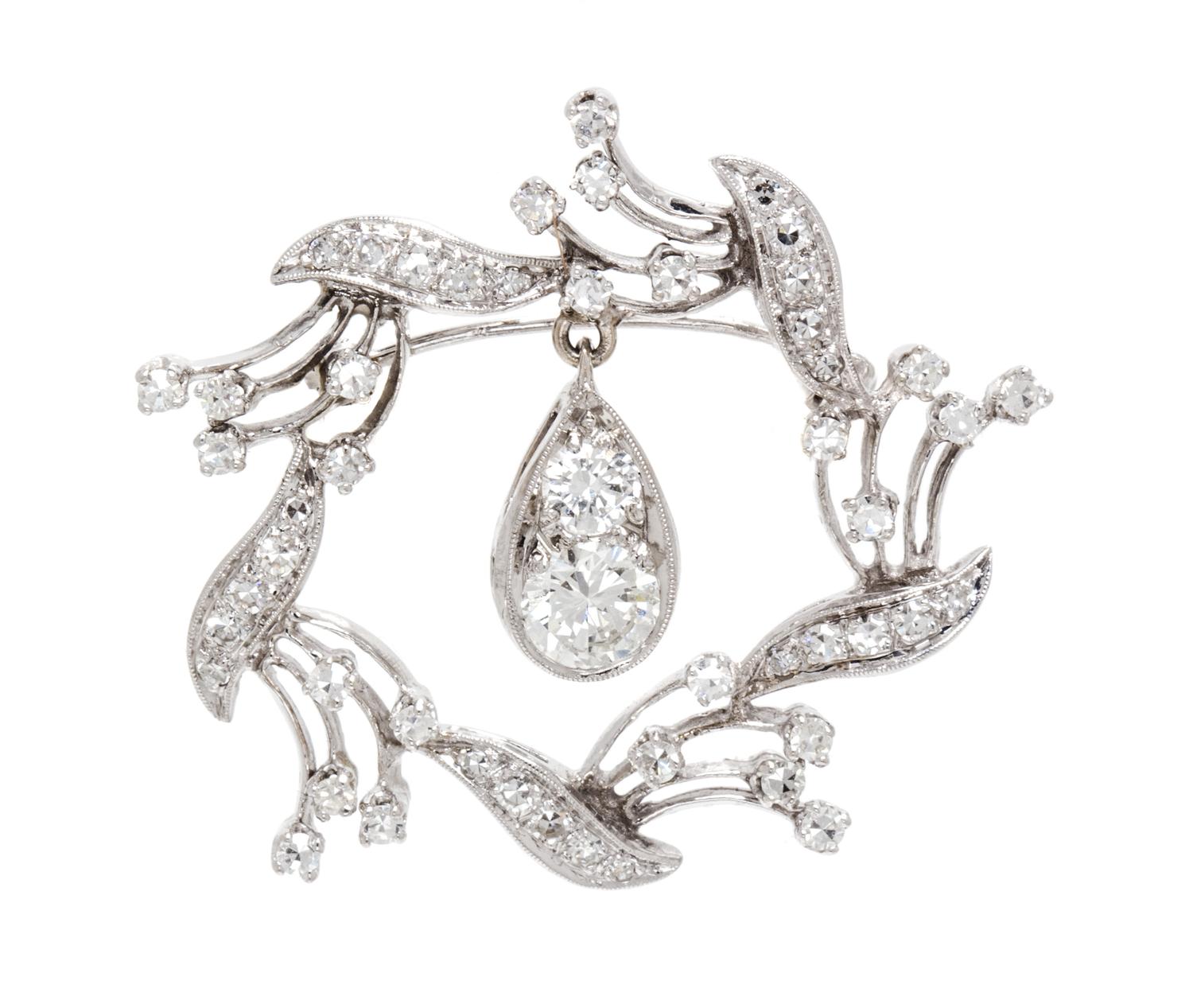 A White Gold and Diamond Pendant/Brooch, 5.10 dwts.