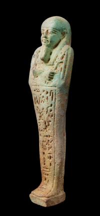 An Egyptian Faience Shabti Height 7 inches. — LATE PERIOD, DYNASTY 26, 664-525 B.C.E.
