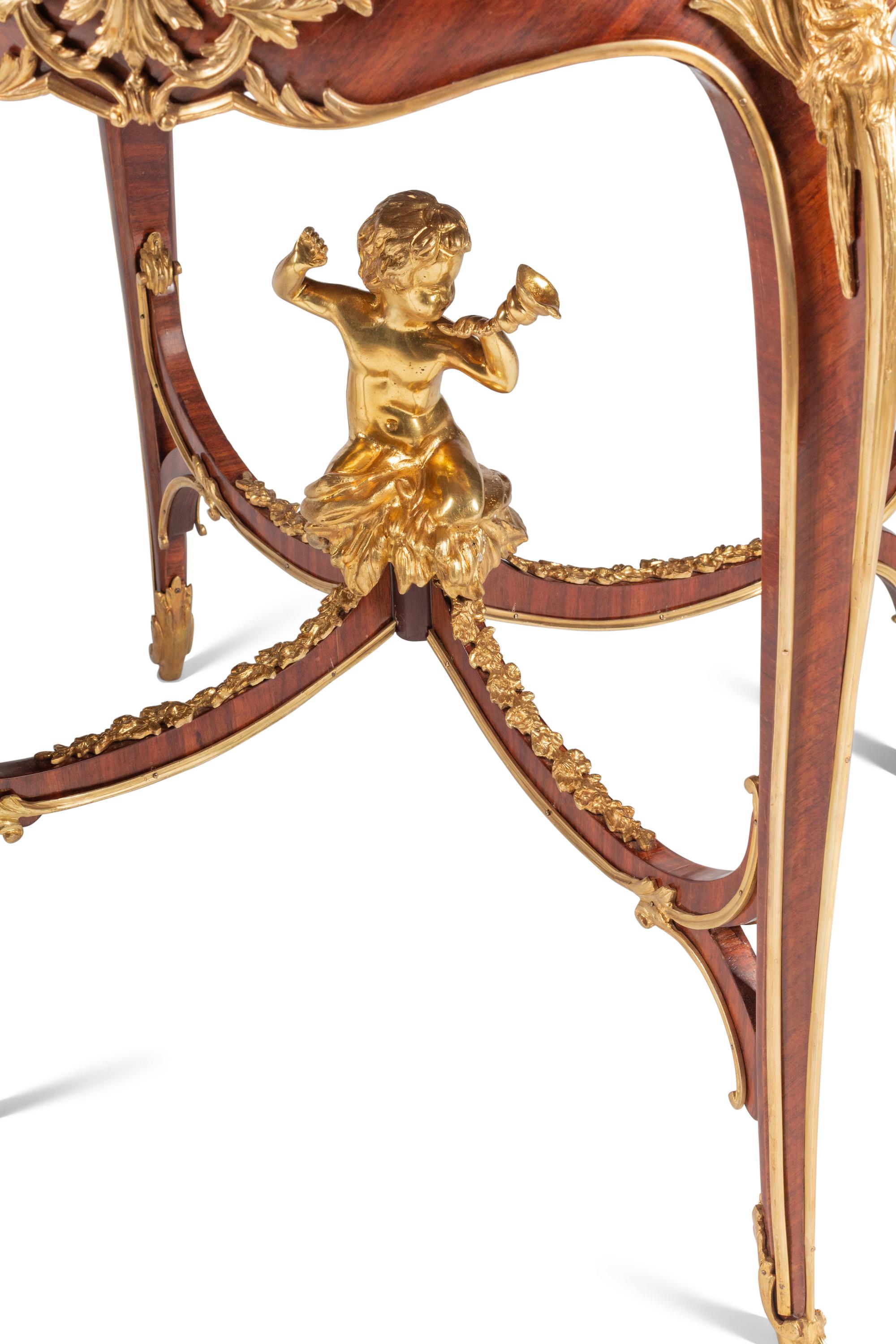 A Pair of Louis XV Style Gilt Bronze Mounted Marquetry and Mahogany Side Tables