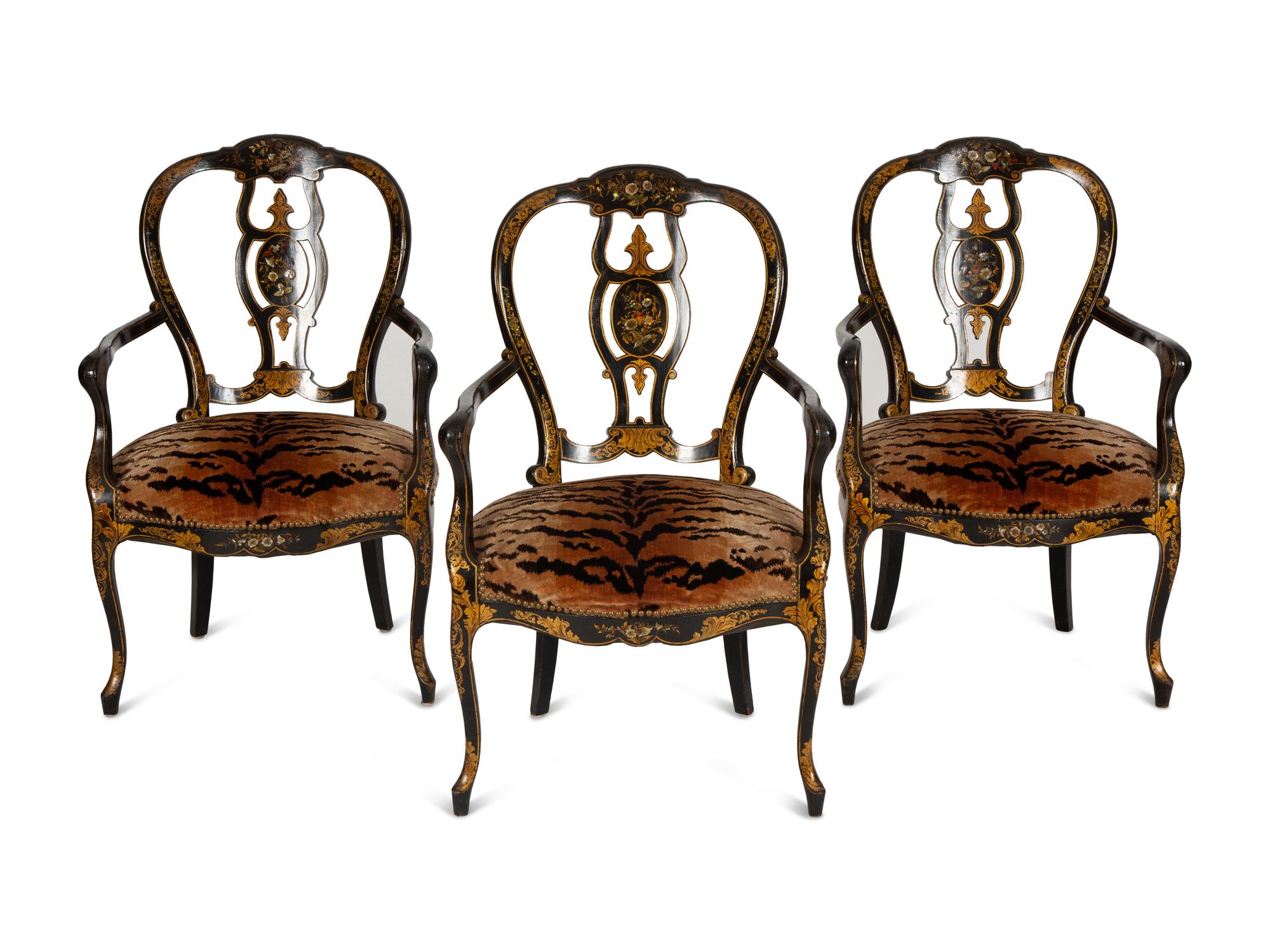 A Set of Three Victorian Ebonized Gilt and Mother of Pearl Chinoiserie Open Armchairs