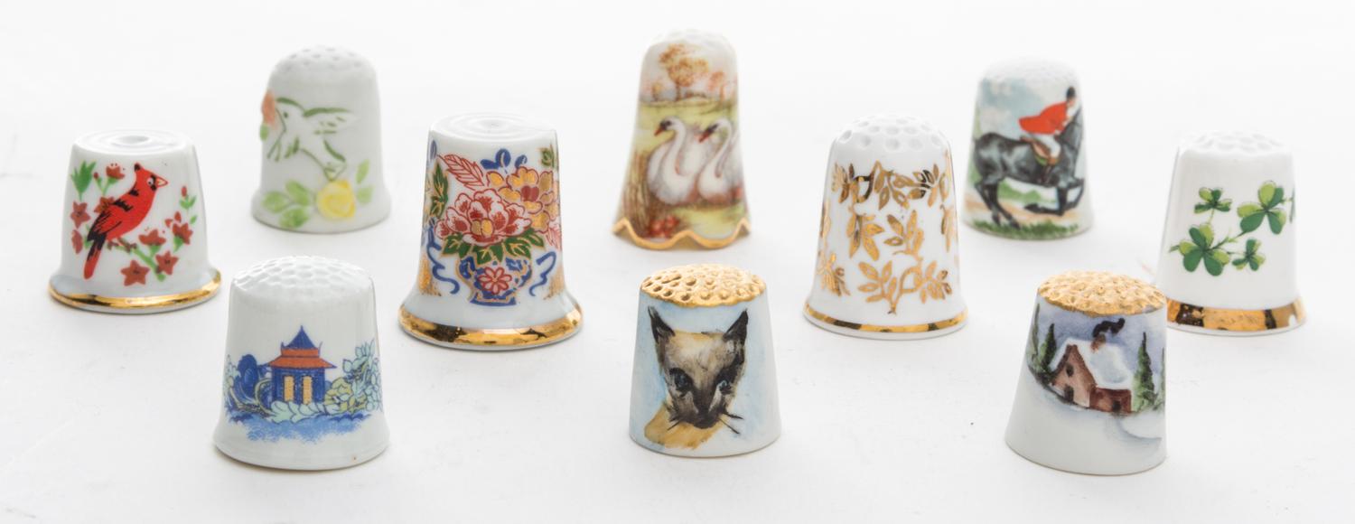 A Group of Porcelain Thimbles Height of first 1 inch.