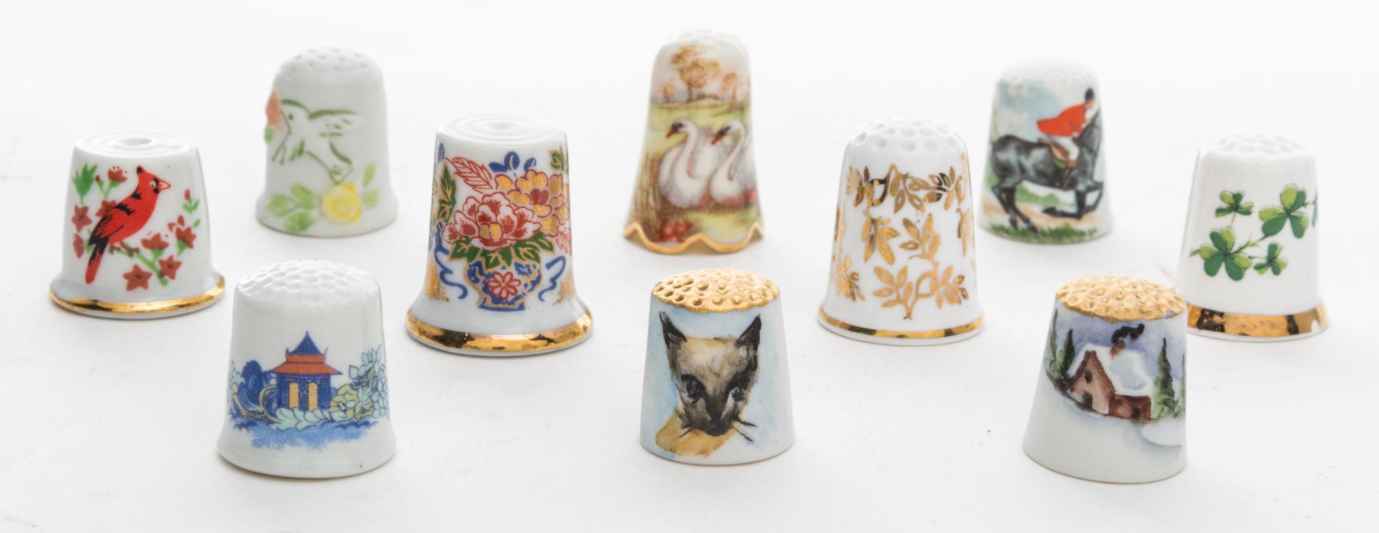 A Group of Porcelain Thimbles Height of first 1 inch.