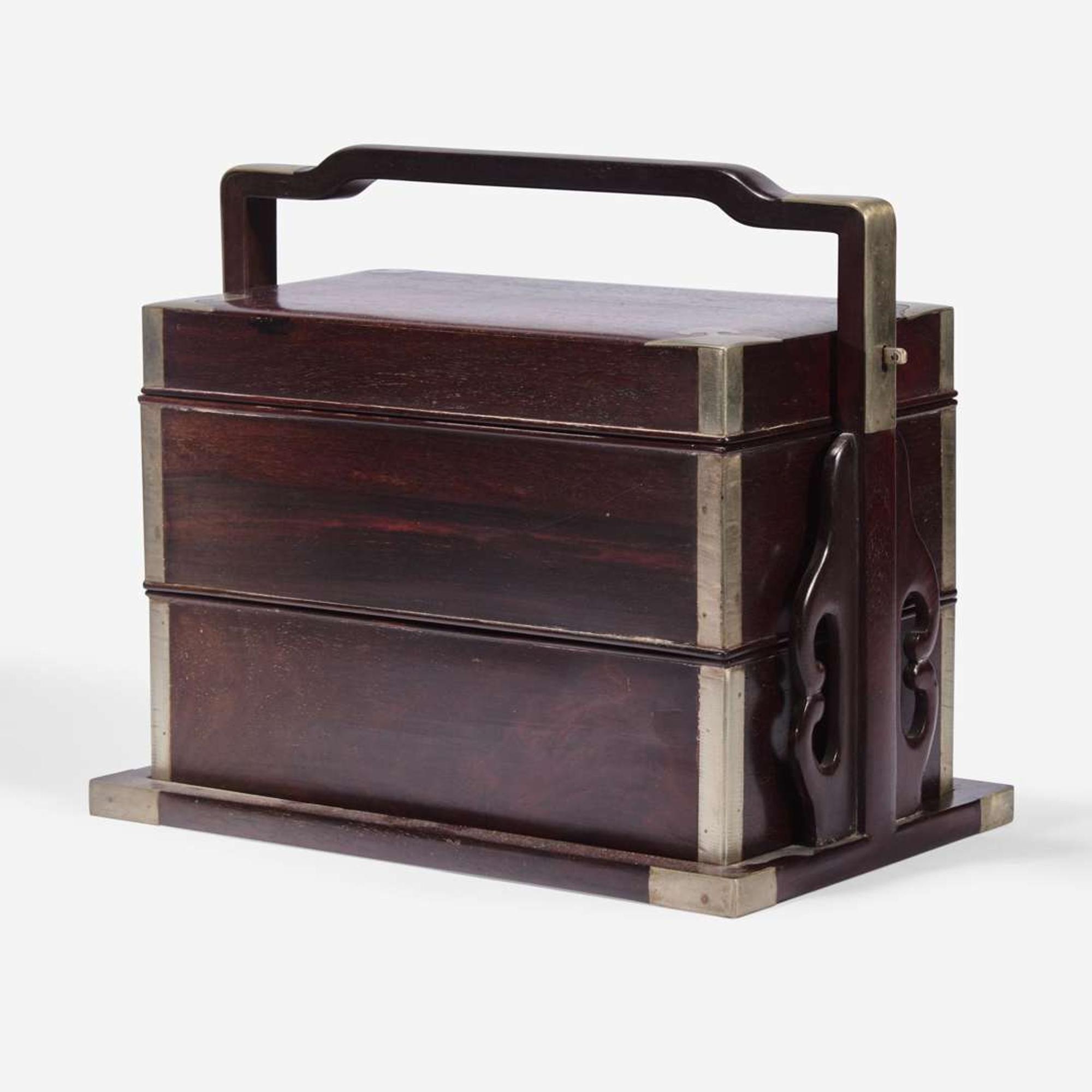 A Chinese stacking hardwood two-tier box, possibly zitan 双层提梁木盒 或紫檀