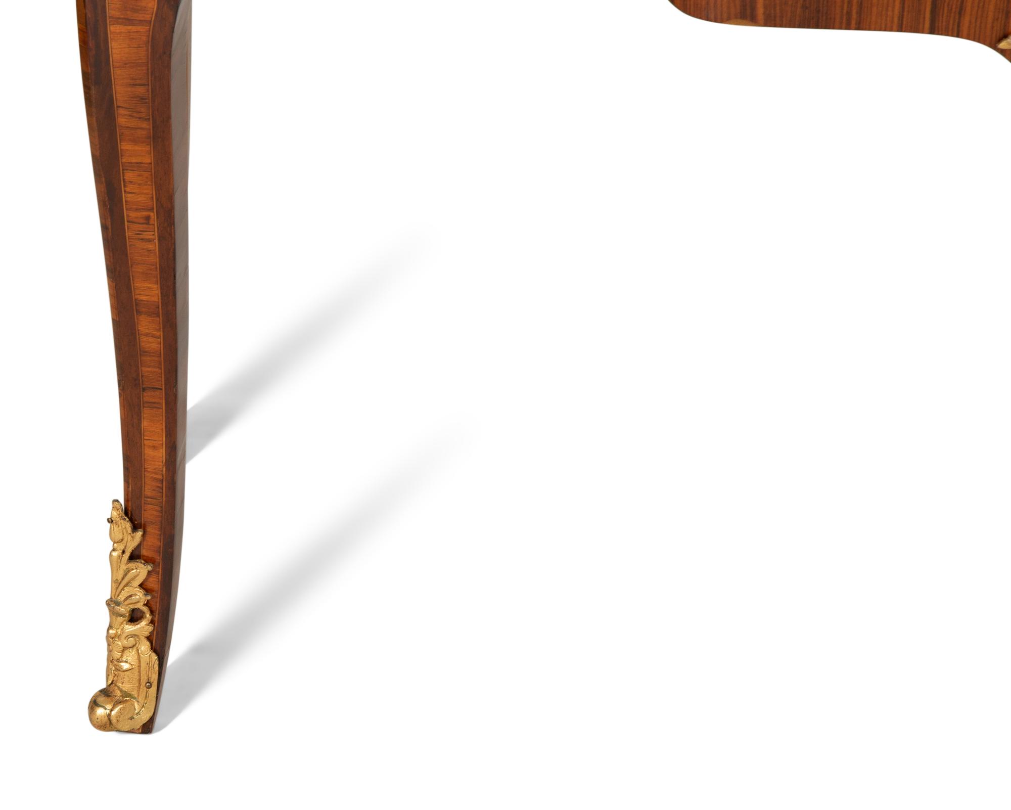 A Louis XV Style Gilt Bronze Mounted Kingwood and Marquetry Marble-Top Commode