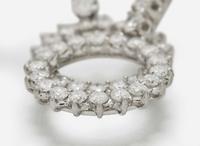 A Pair of 14K White Gold and Diamond Ear Clips