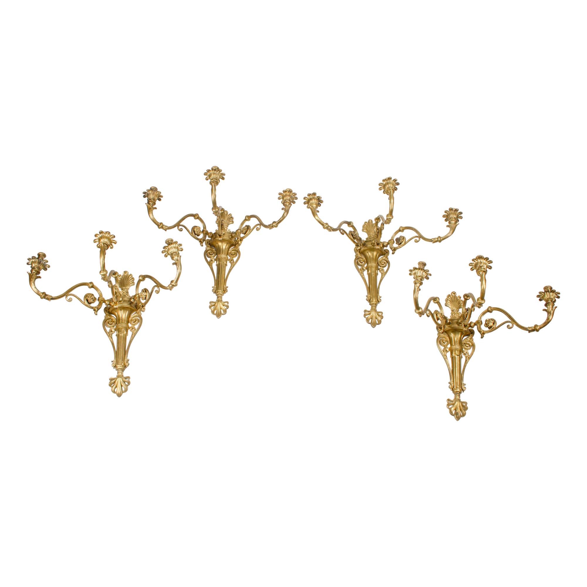 A Set of Four Large Gilt Bronze Three-Light Sconces