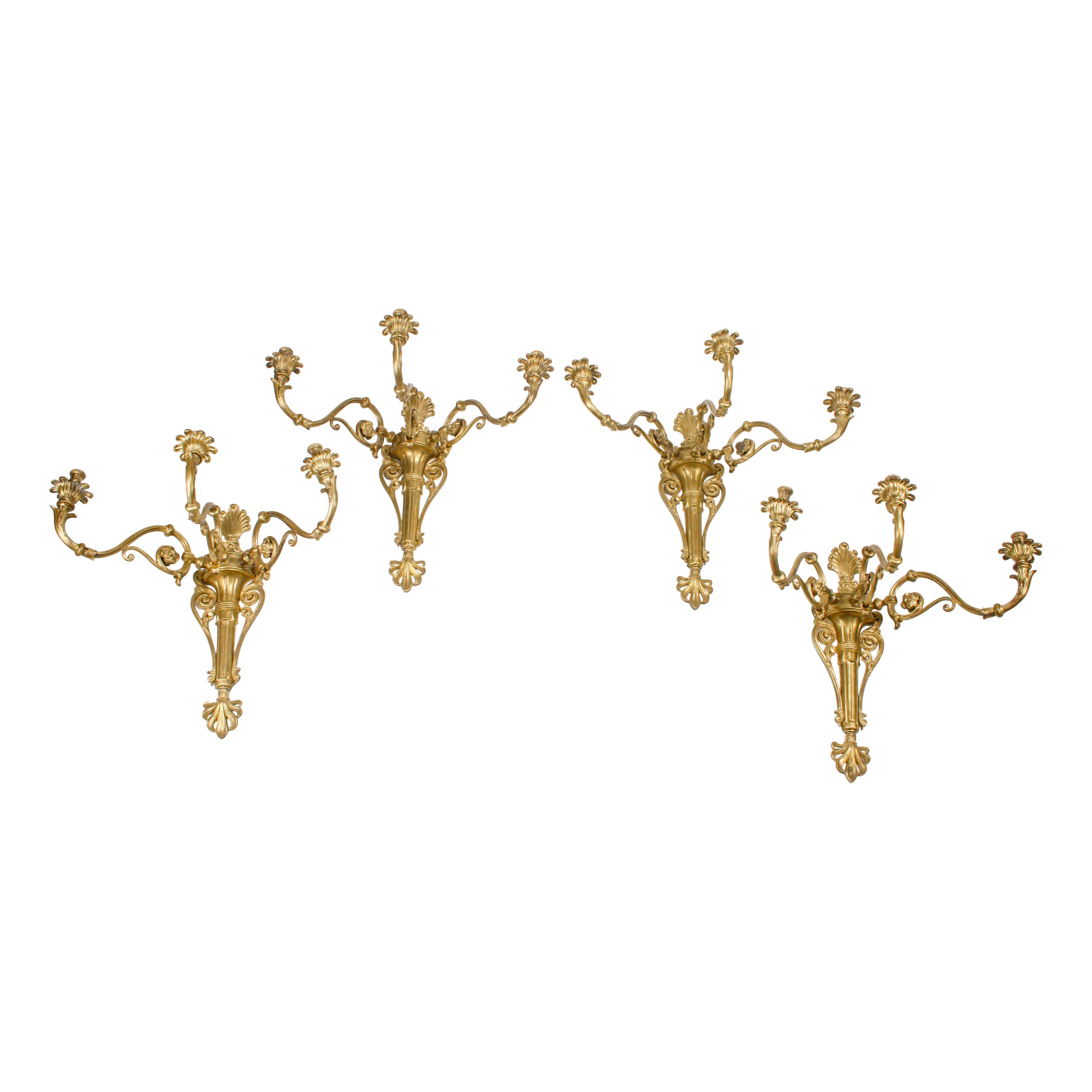 A Set of Four Large Gilt Bronze Three-Light Sconces