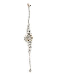 FRENCH, PLATINUM AND DIAMOND SURPRISE WATCH