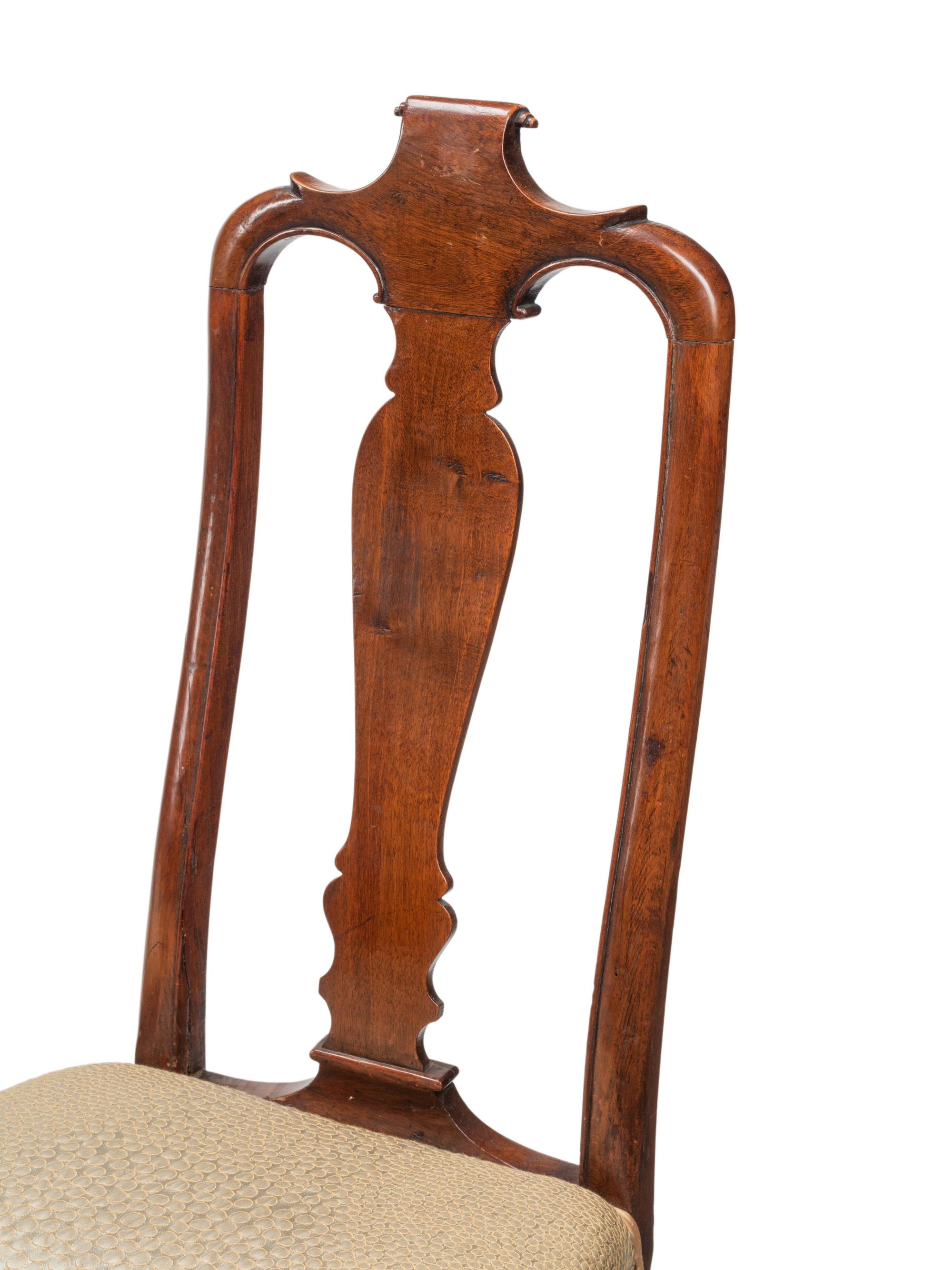 A Set of Eight Dutch Rococo Walnut Dining Chairs