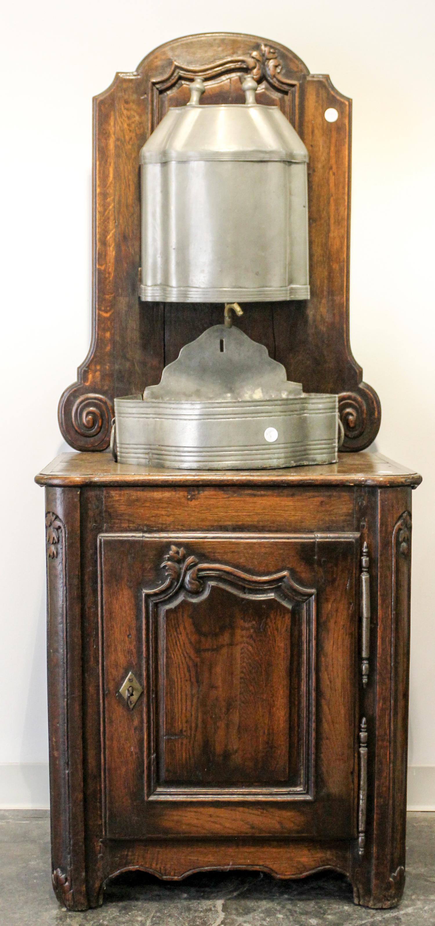 A Wash Stand with Pewter Lavabo and Basin Height 64 1/2 x width 27 x depth 18 1/4 inches.